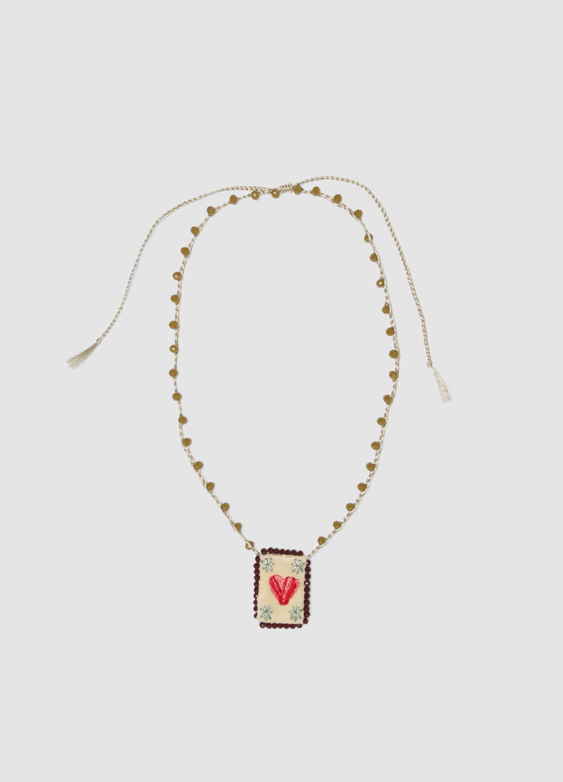 Green necklace with embroidered heart pendant