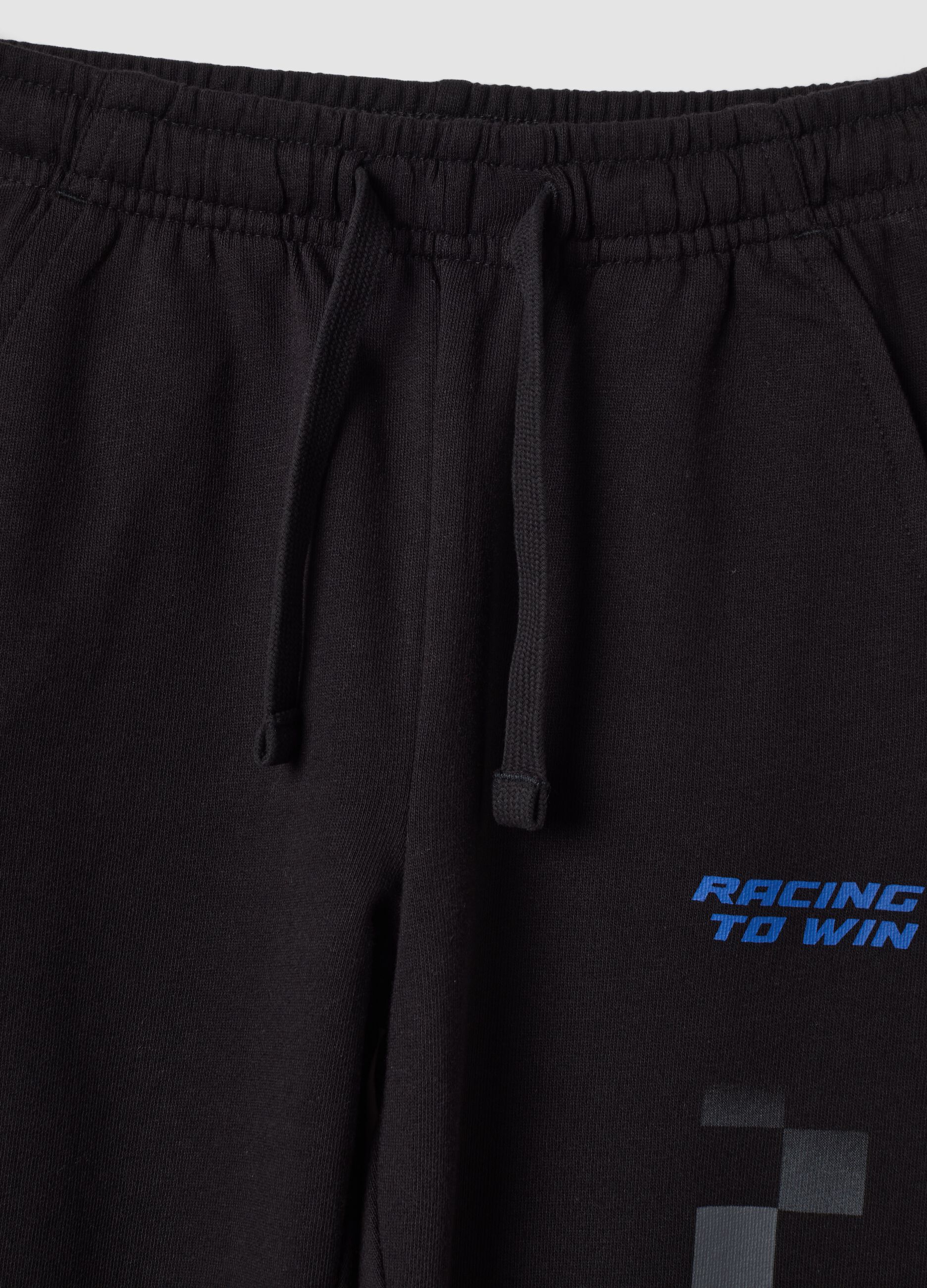 Pantaloni jogger neri in puro cotone con stampa a scacchi