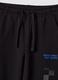 Pantaloni jogger neri in puro cotone con stampa a scacchi_2