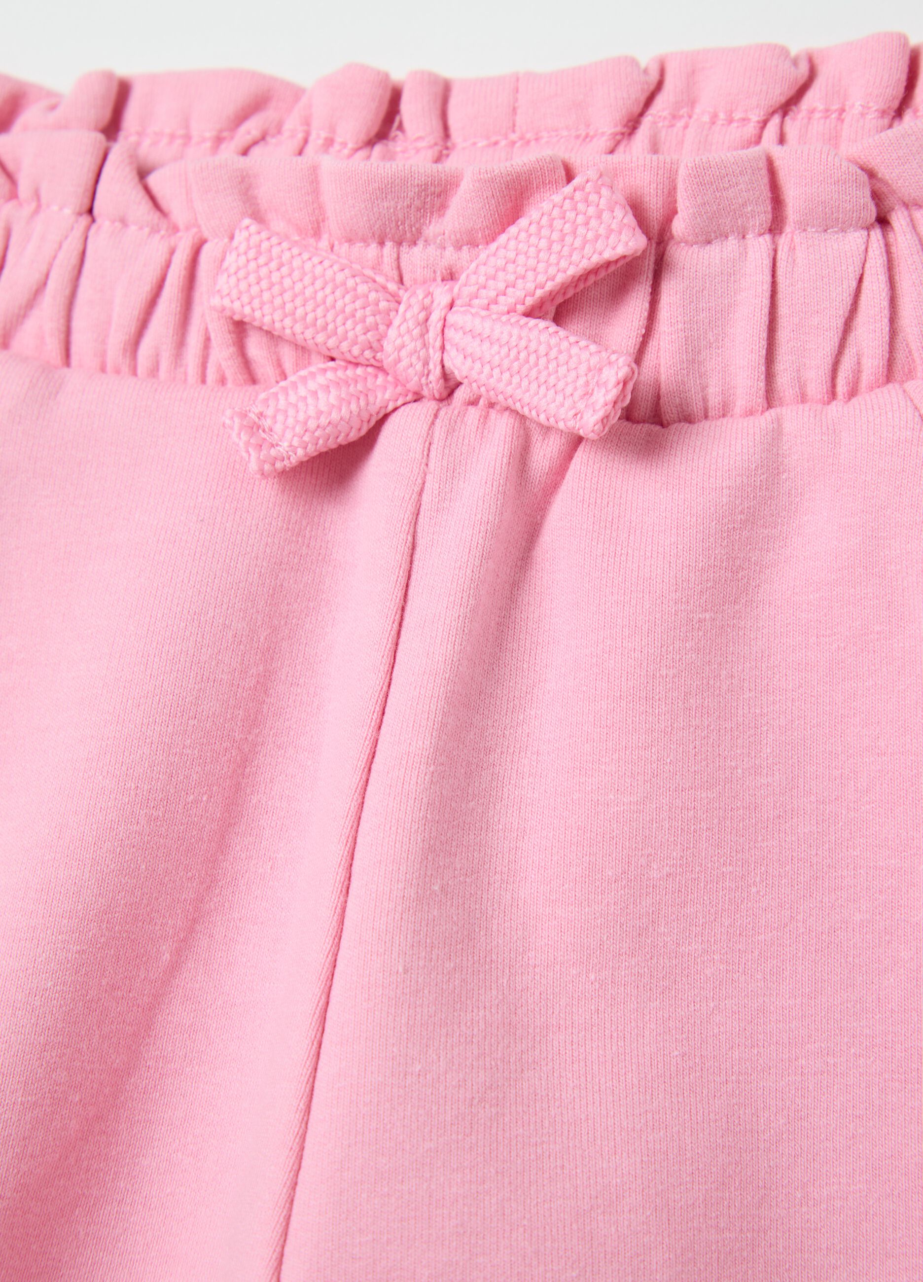 Pink French terry shorts with bow and frills