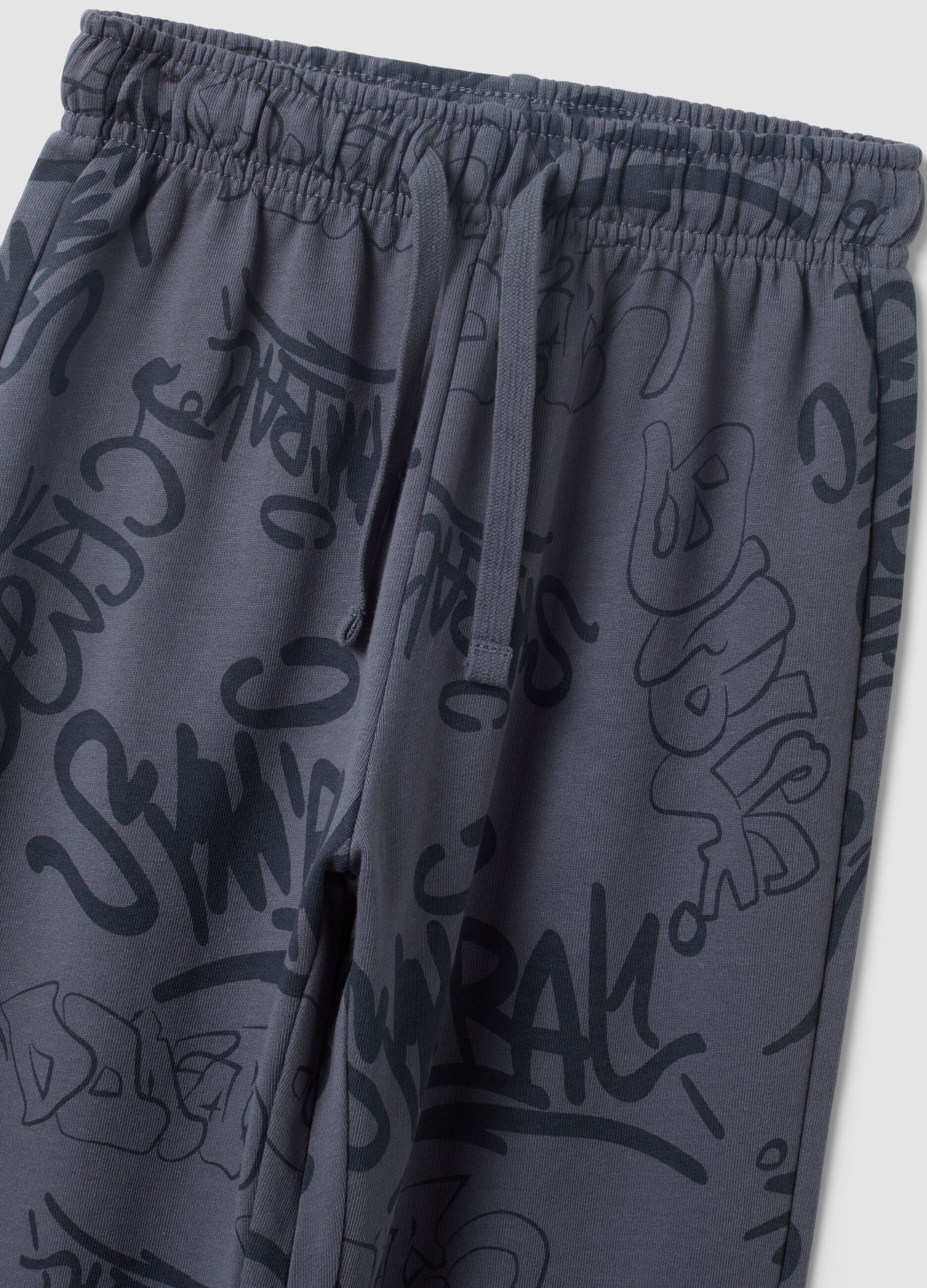 Grey oversized cotton jogger trousers with all-over print for boys