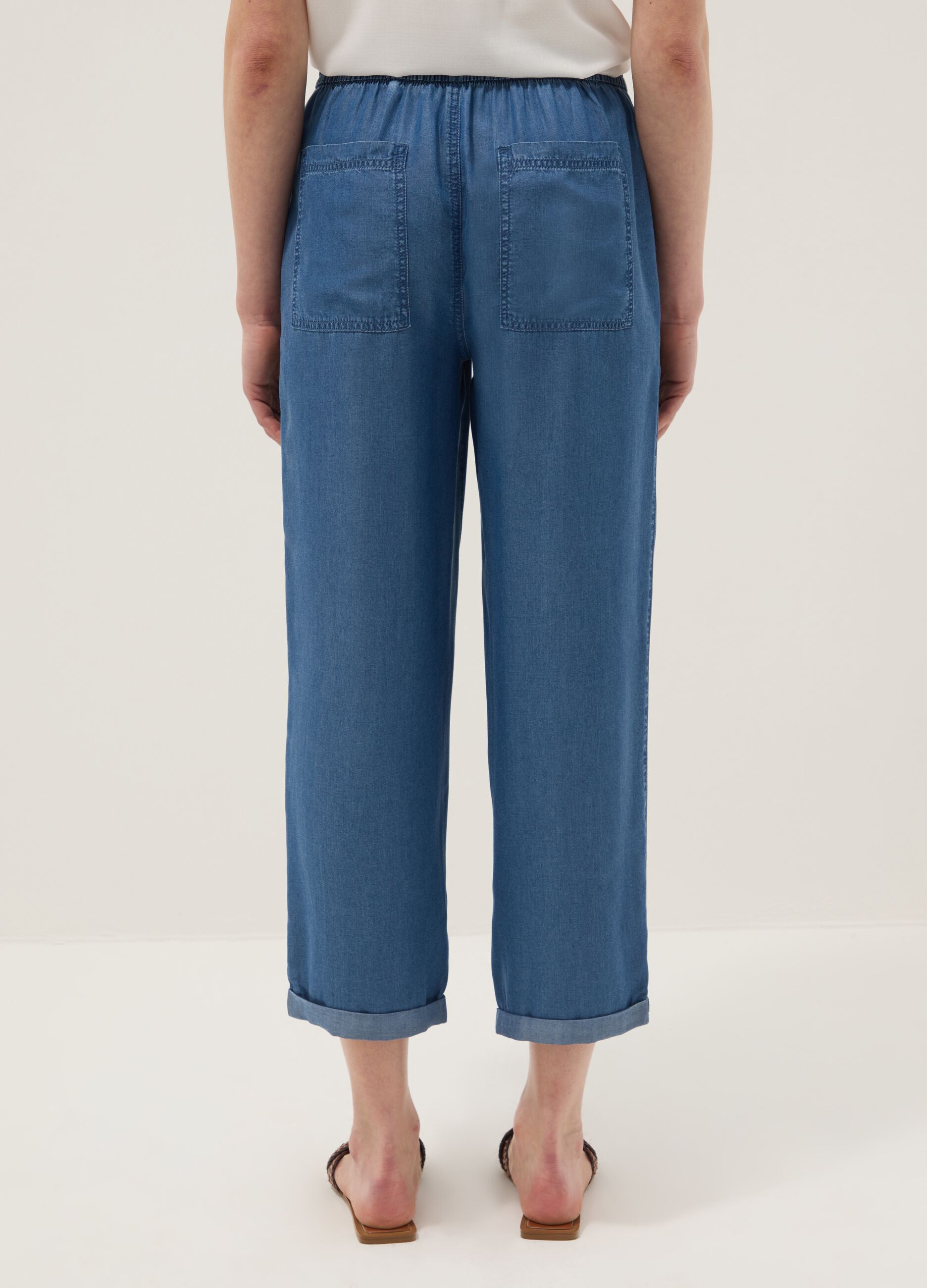 Light blue denim jeans in 100% lyocell with elasticated waist, relaxed fit