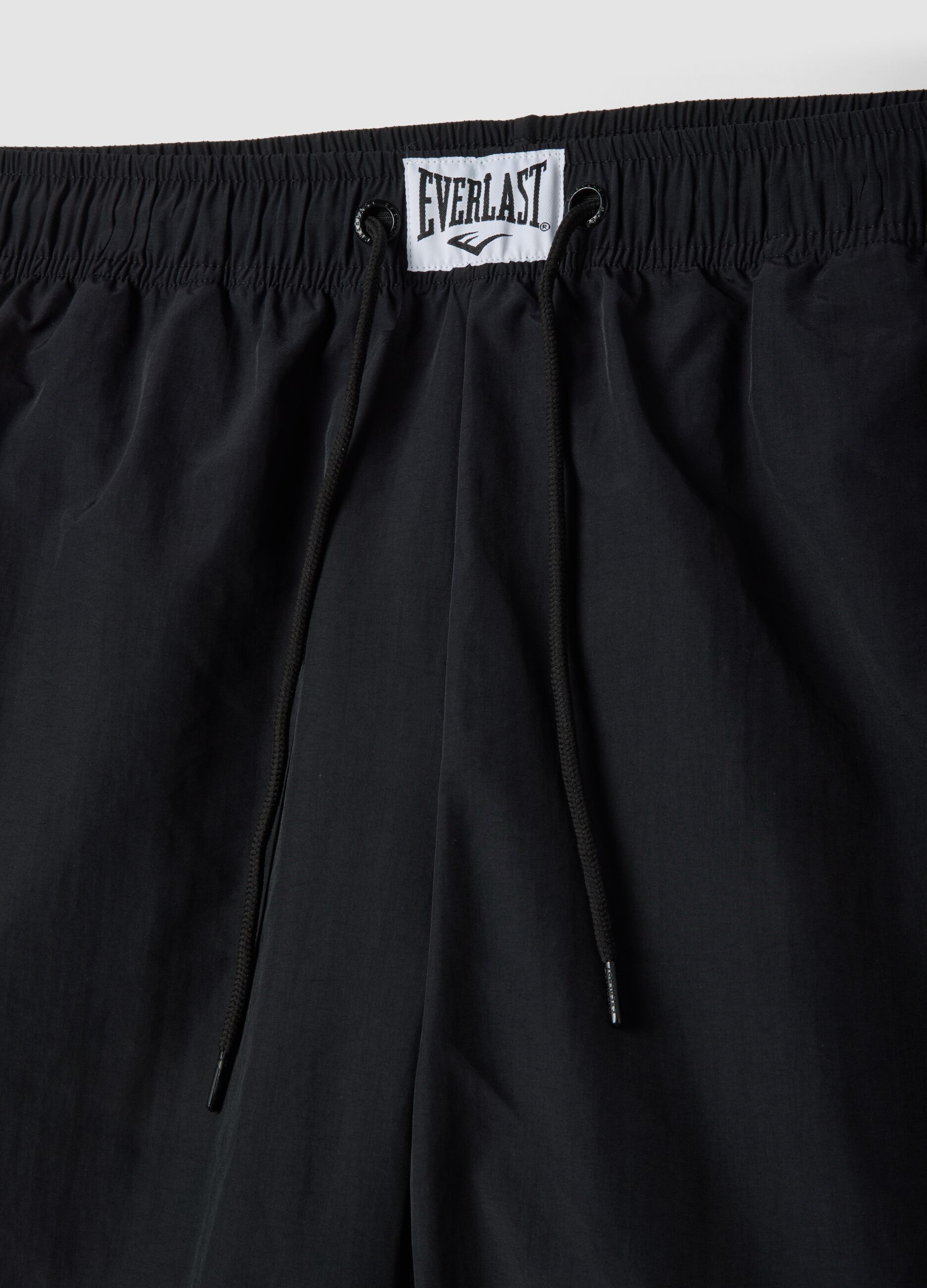 Regular fit black sports shorts with white and orange details