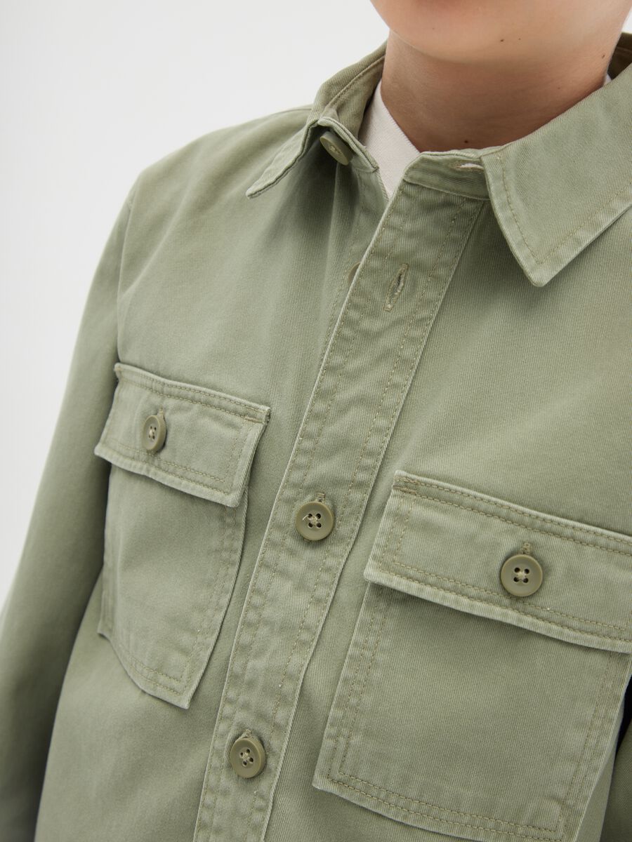 Boys’ shirt in 100% green cotton with oversized fit and button fastening_1