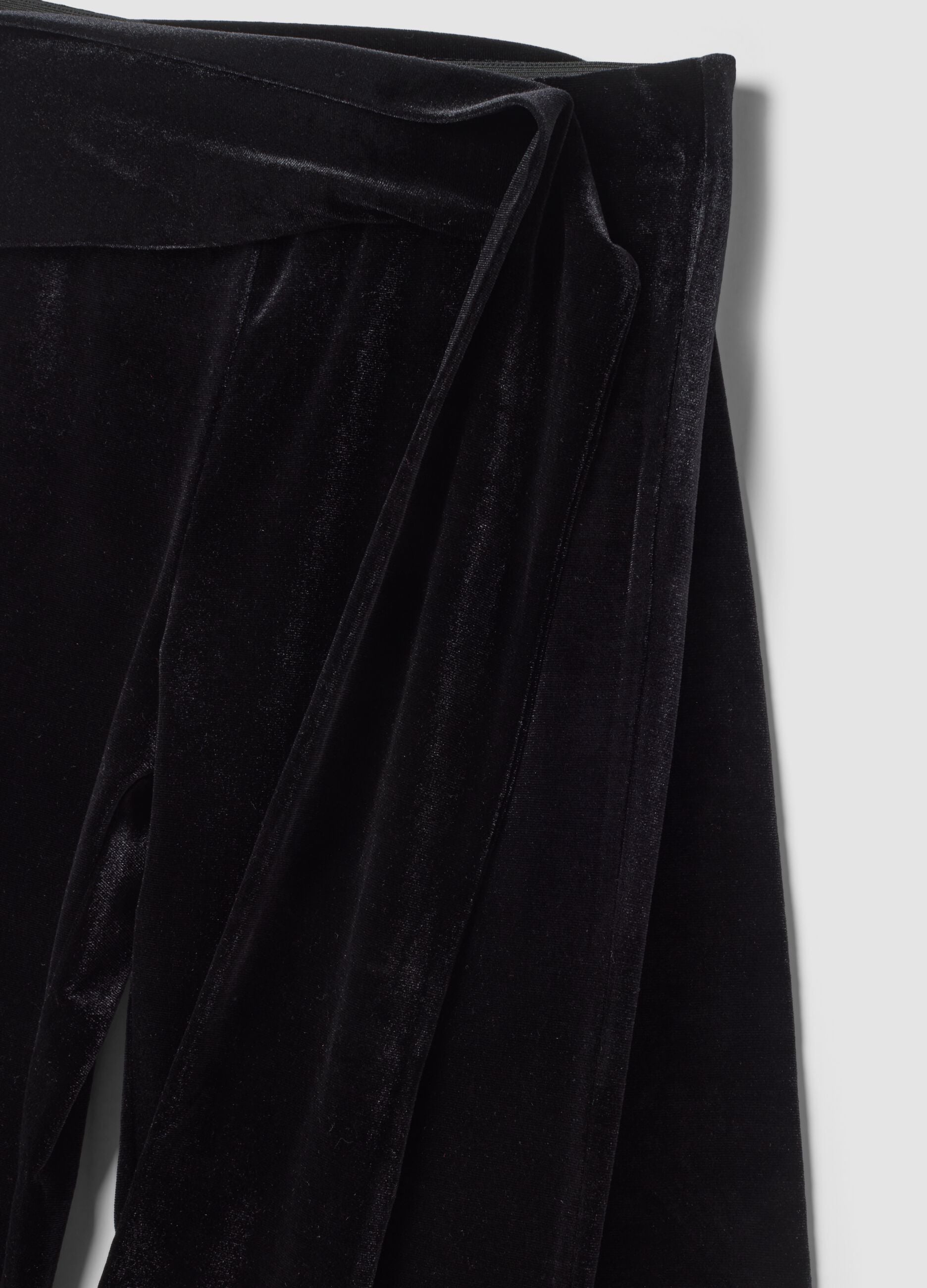Black velour flare trousers in stretch fabric with side bow detail