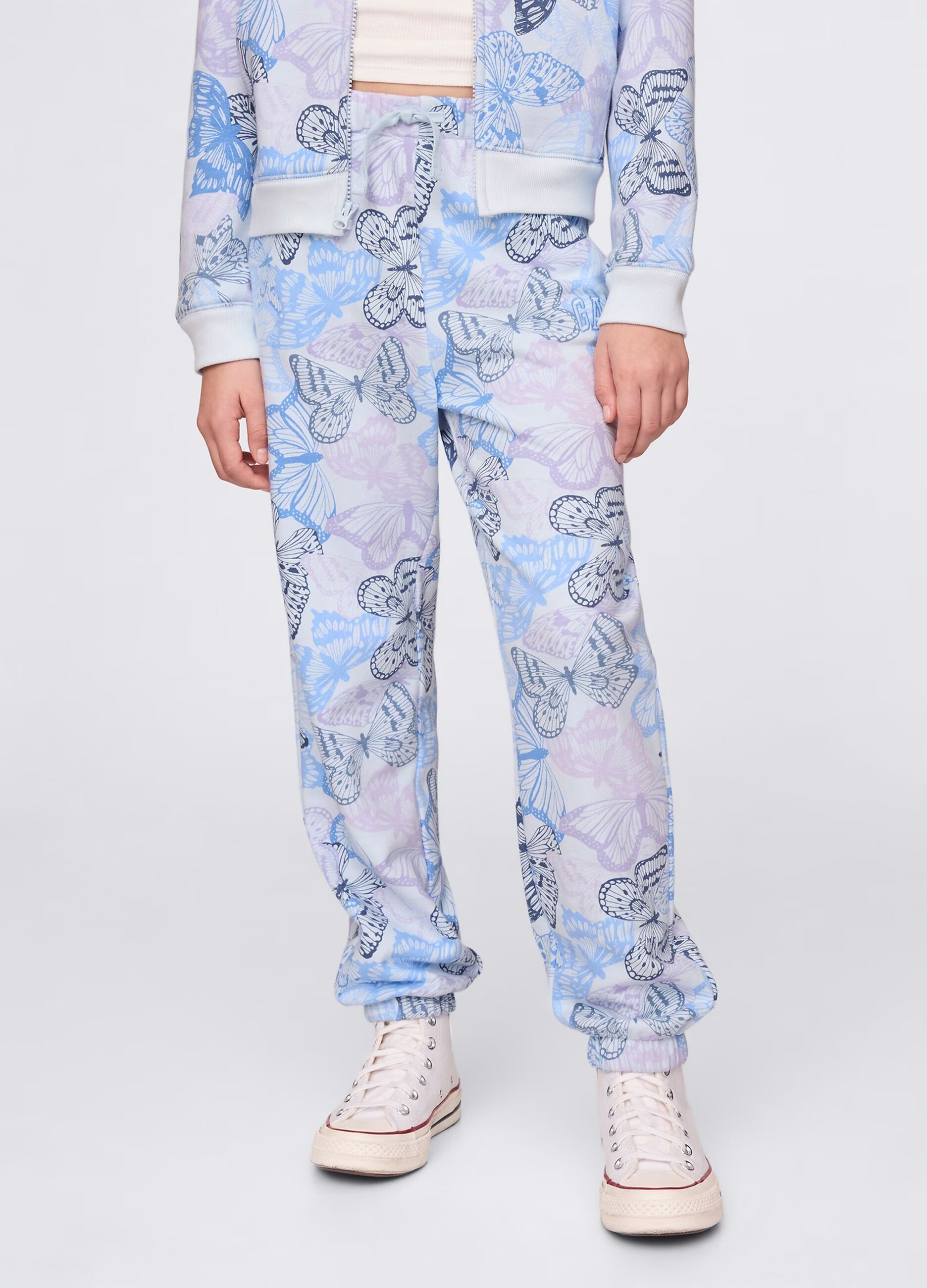 Light blue joggers with drawstring, logo embroidery and butterflies print