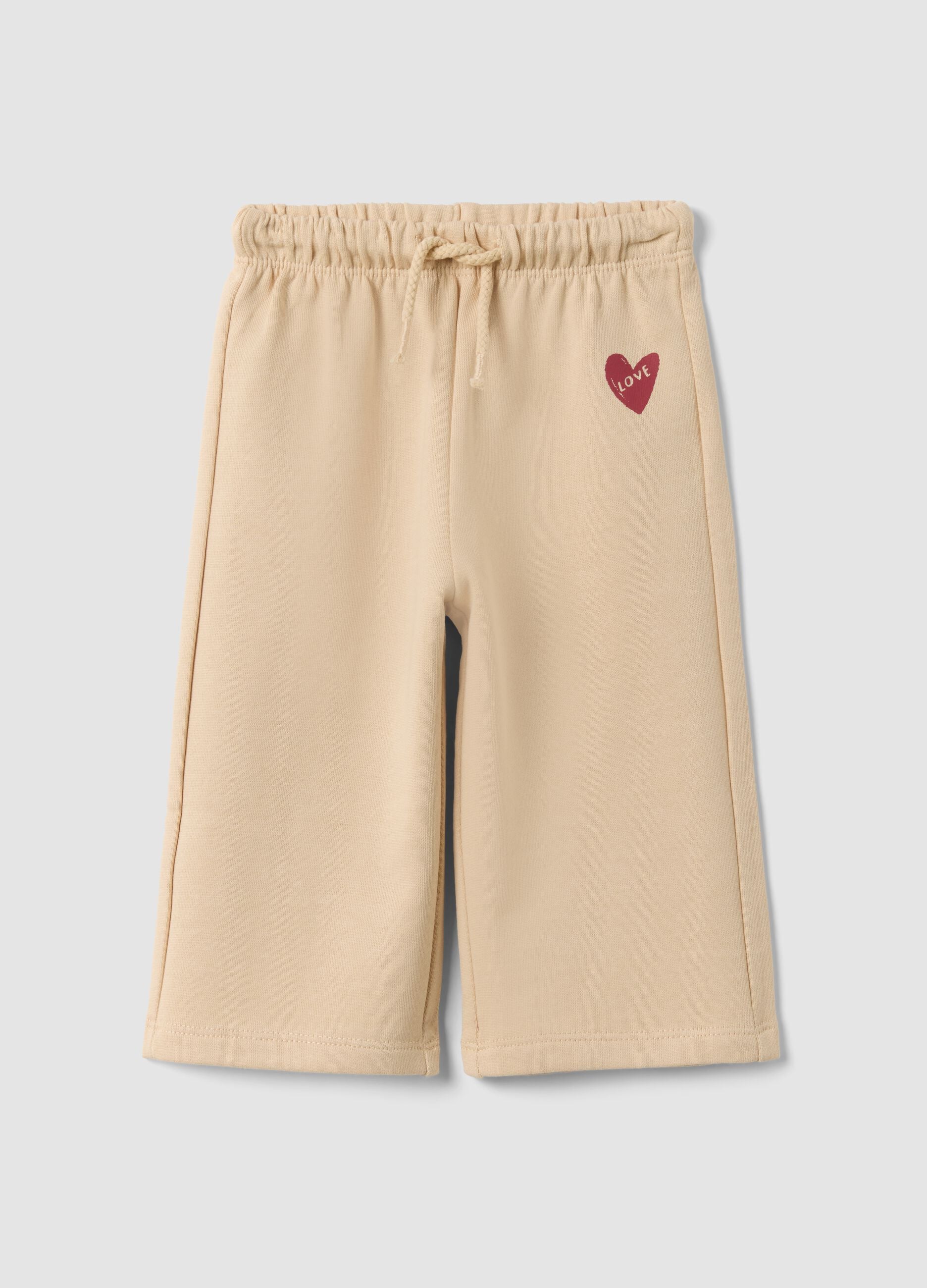 Pantaloni beige in puro cotone con vita elastica e stampa per bimba