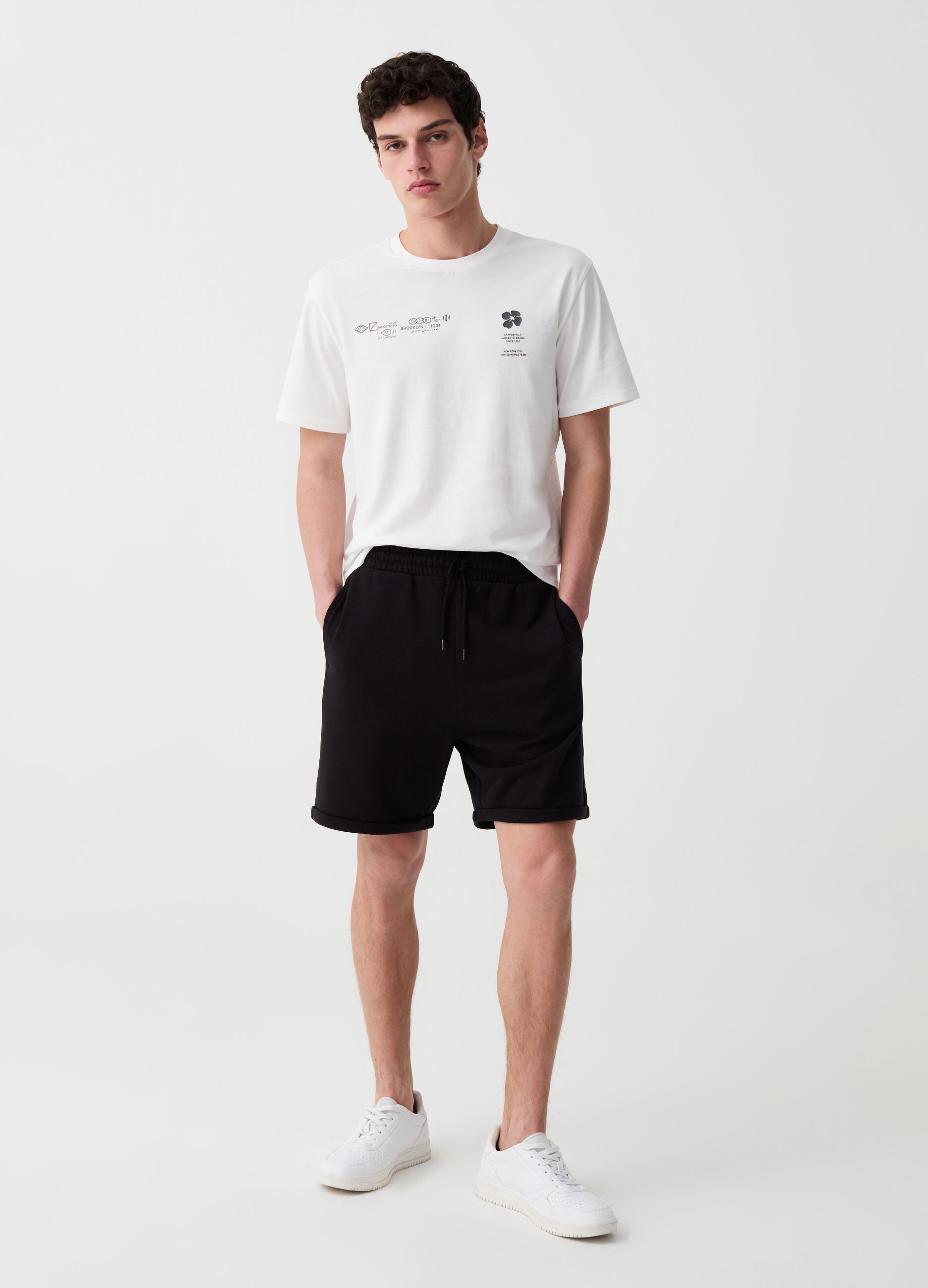 Bermuda jogger in felpa con risvolti