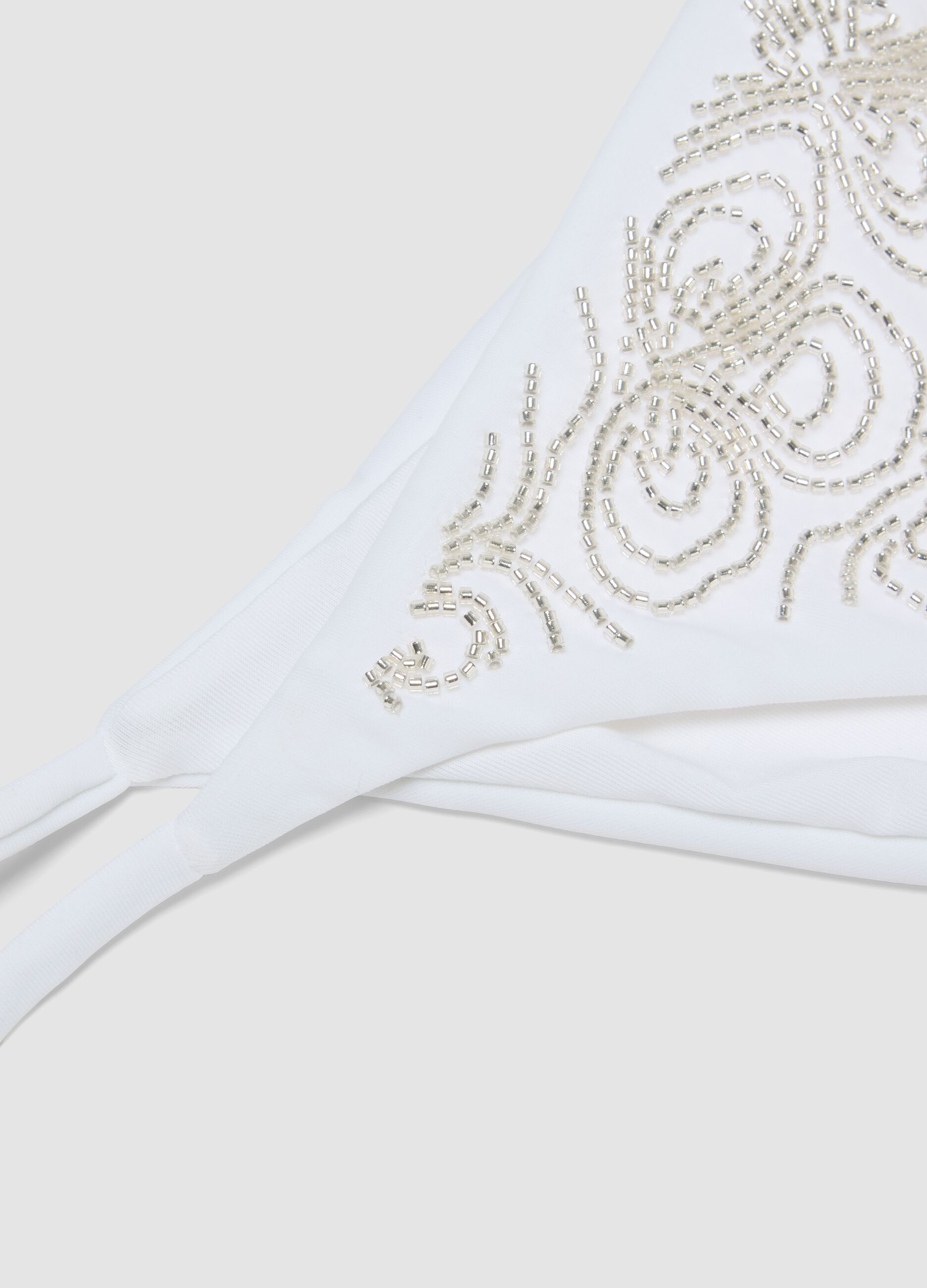 White stretch bikini bottoms with decorative beads