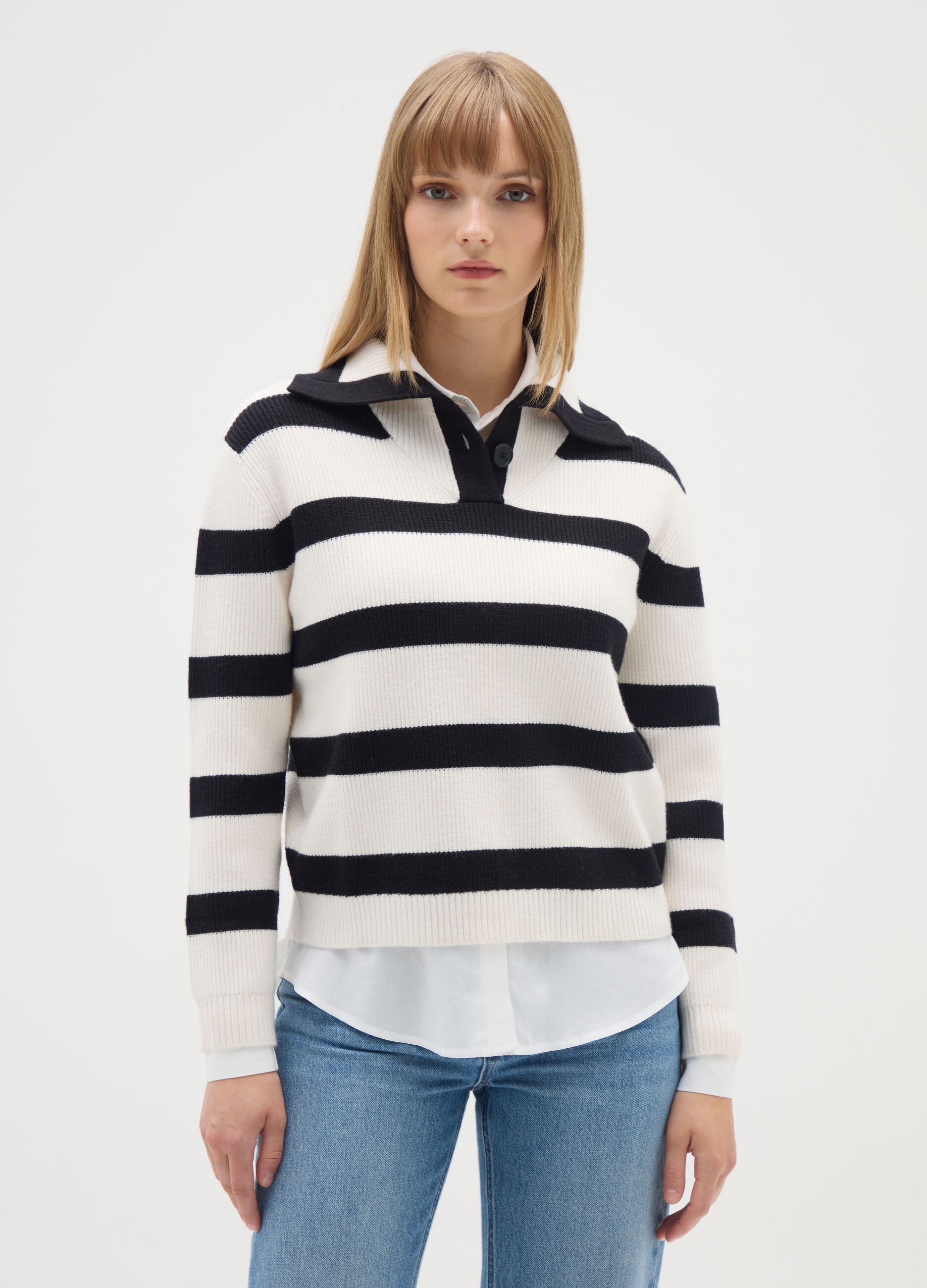 White jumper with black stripes and collar