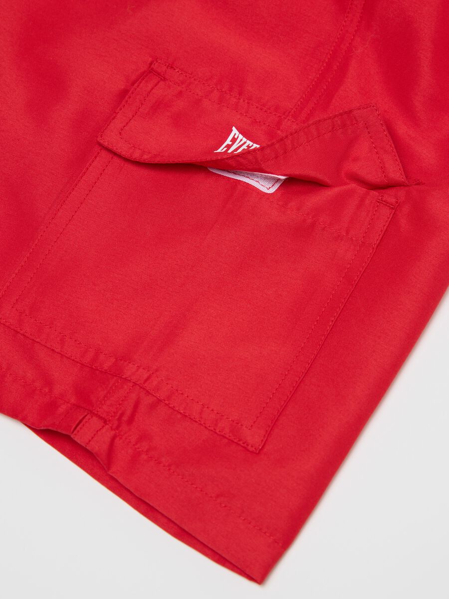 Red swimming trunks with logo print_5