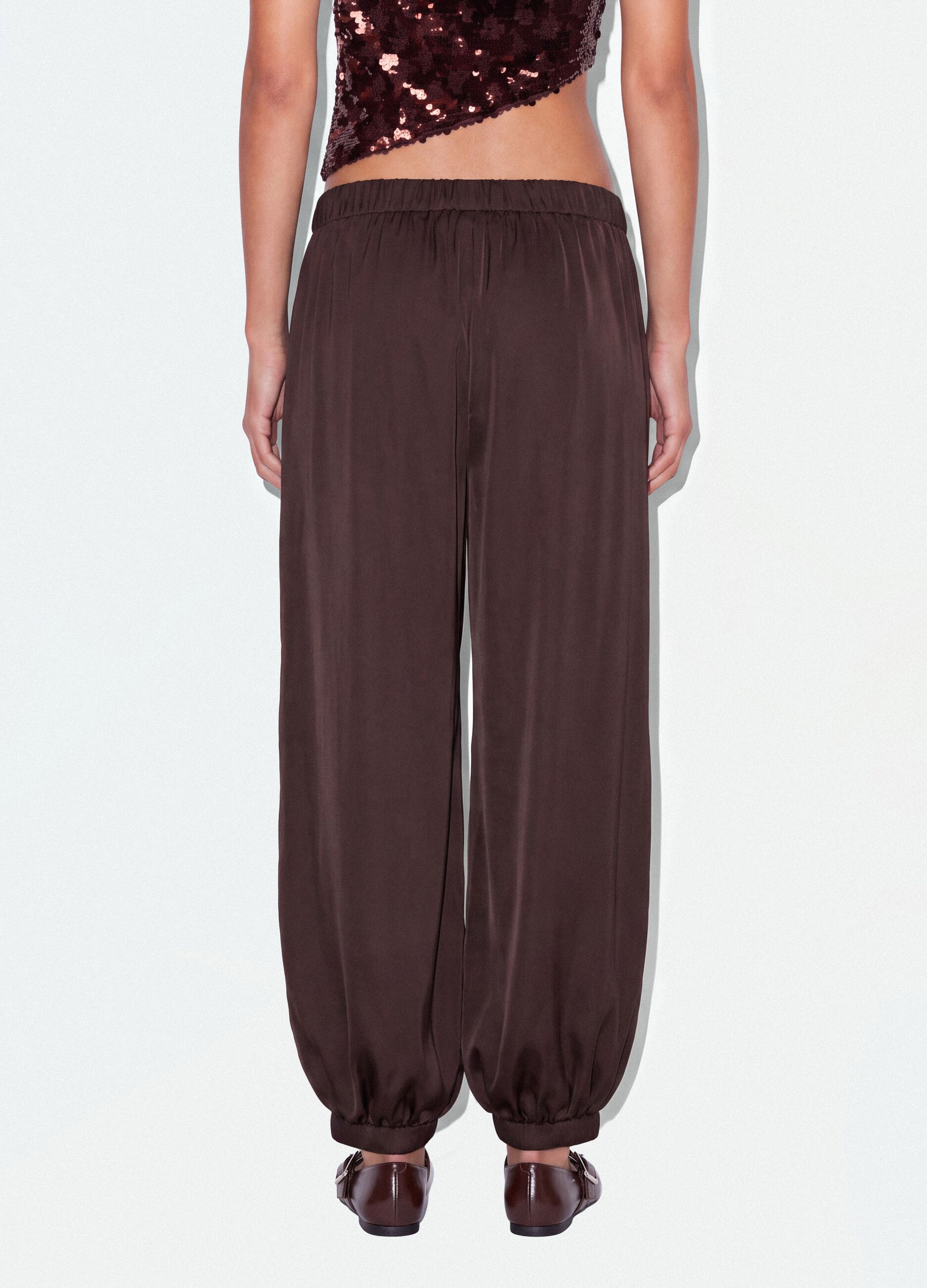 Brown baggy-fit trousers with elasticated cuffs