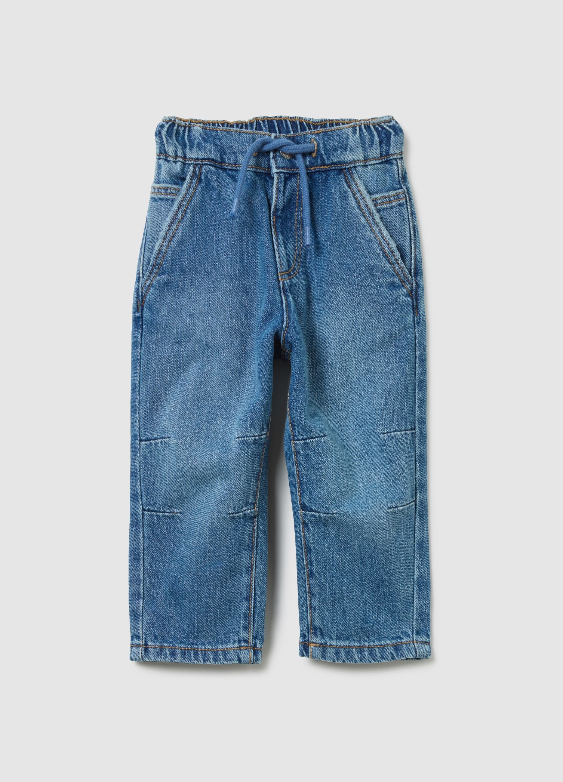 Pantaloni blu in denim con elastico e coulisse