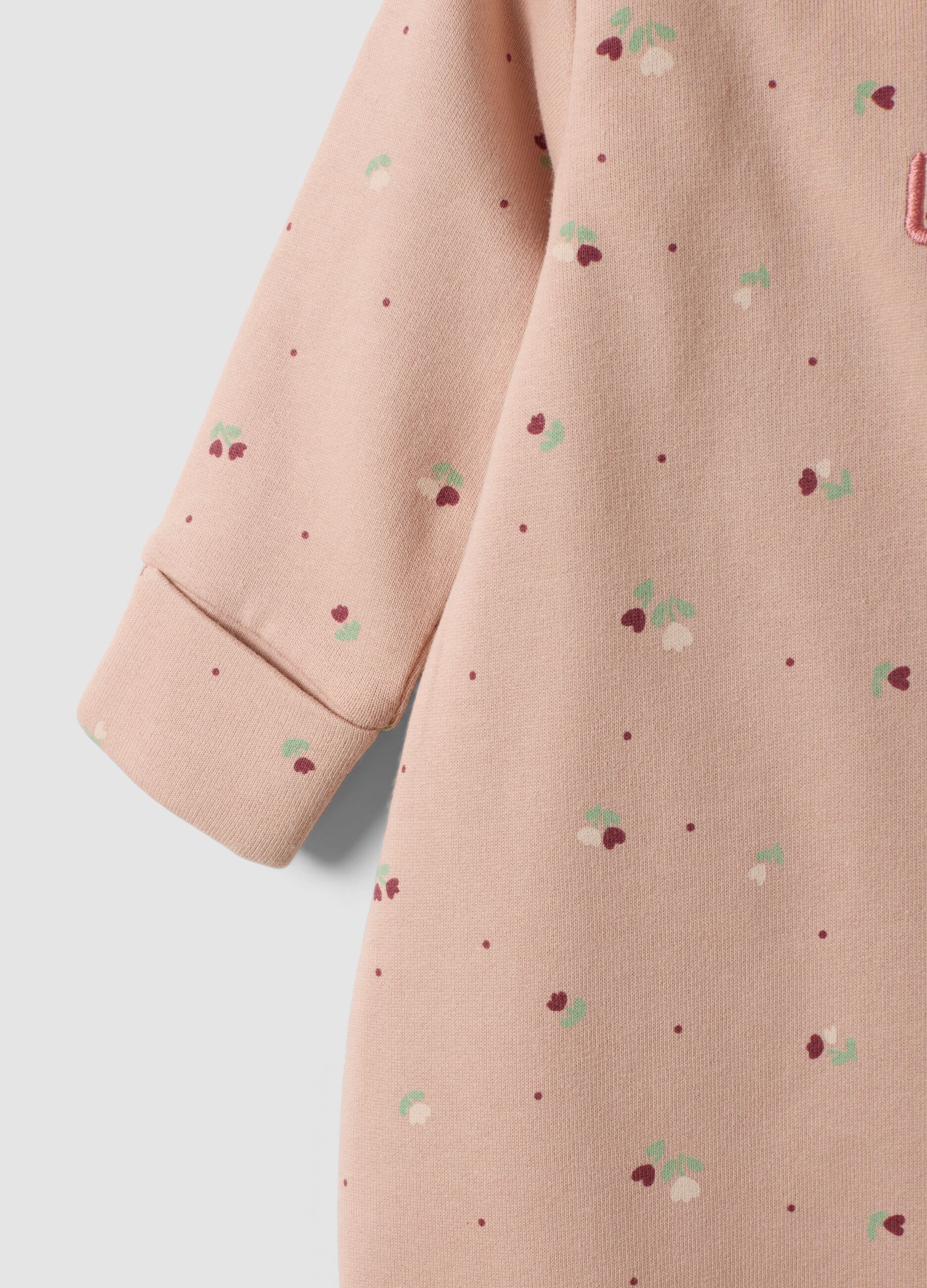Tutina rosa in puro cotone organico con fantasia fiori per neonata