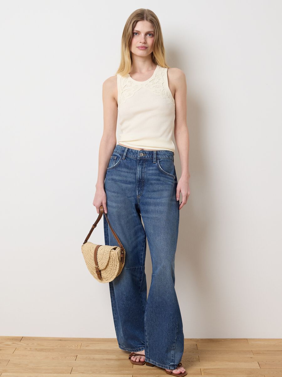 Ivory sleeveless top with embroidered details_1