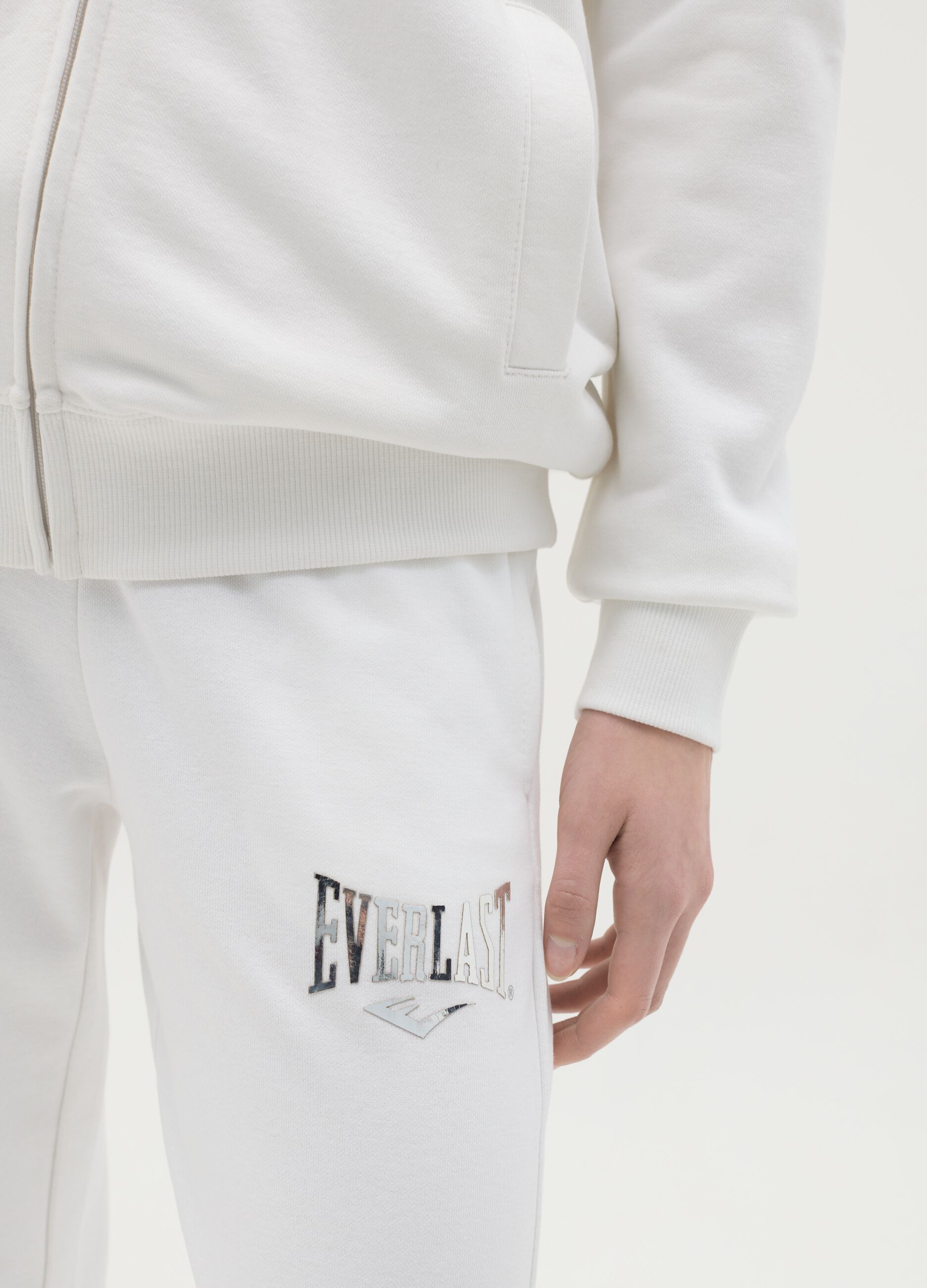 White flare joggers with drawstring and logo print