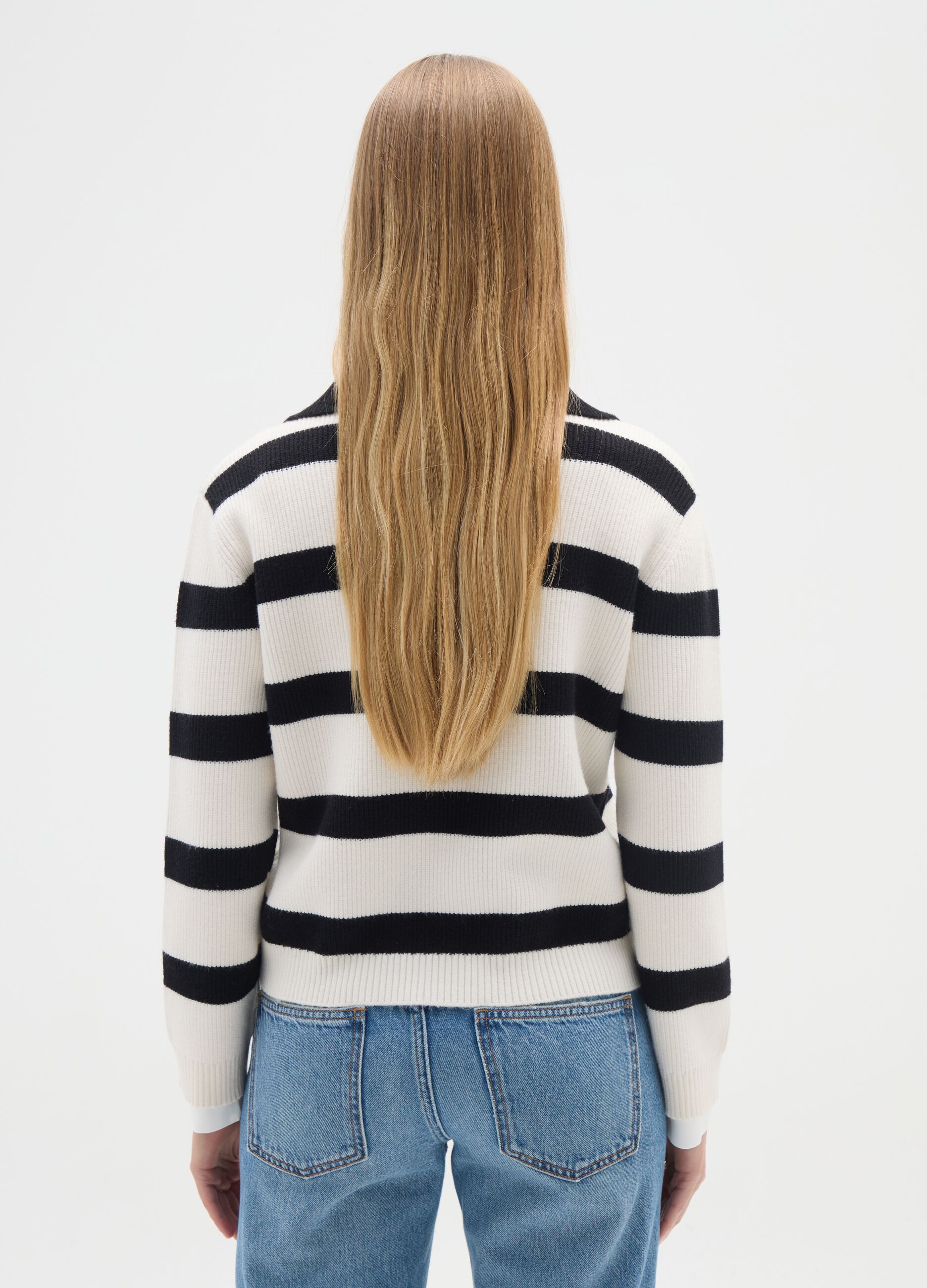 White jumper with black stripes and collar