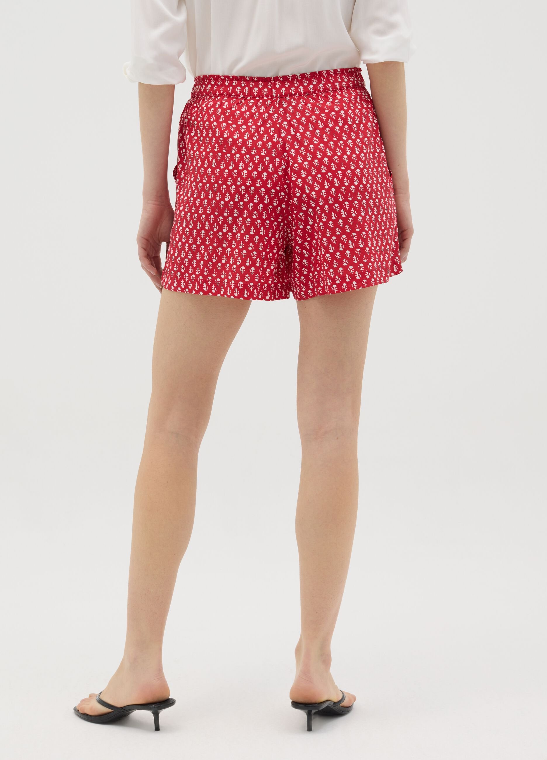 Red viscose shorts with ethnic pattern