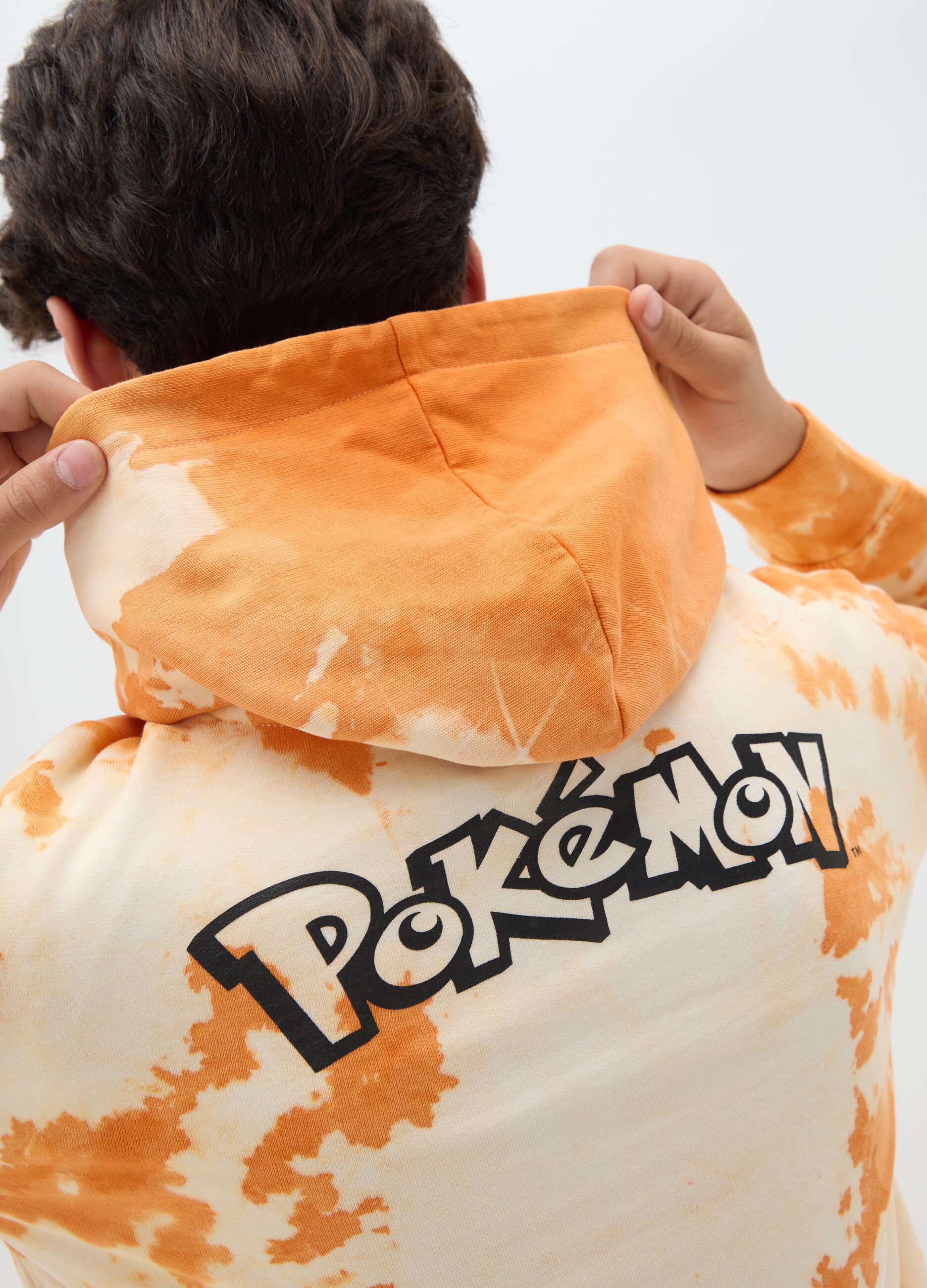 Orange tie-dye sweatshirt with hood and Charizard print