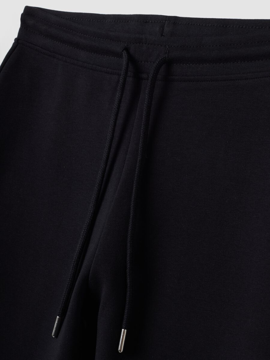 Blue flared joggers in stretch organic cotton_1