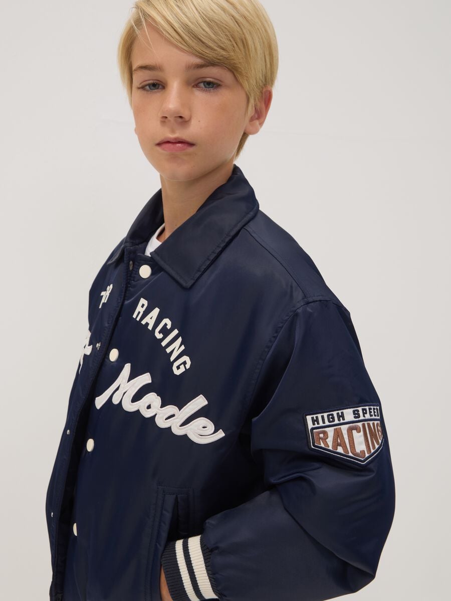 Blue varsity jacket with zip and racing print_1