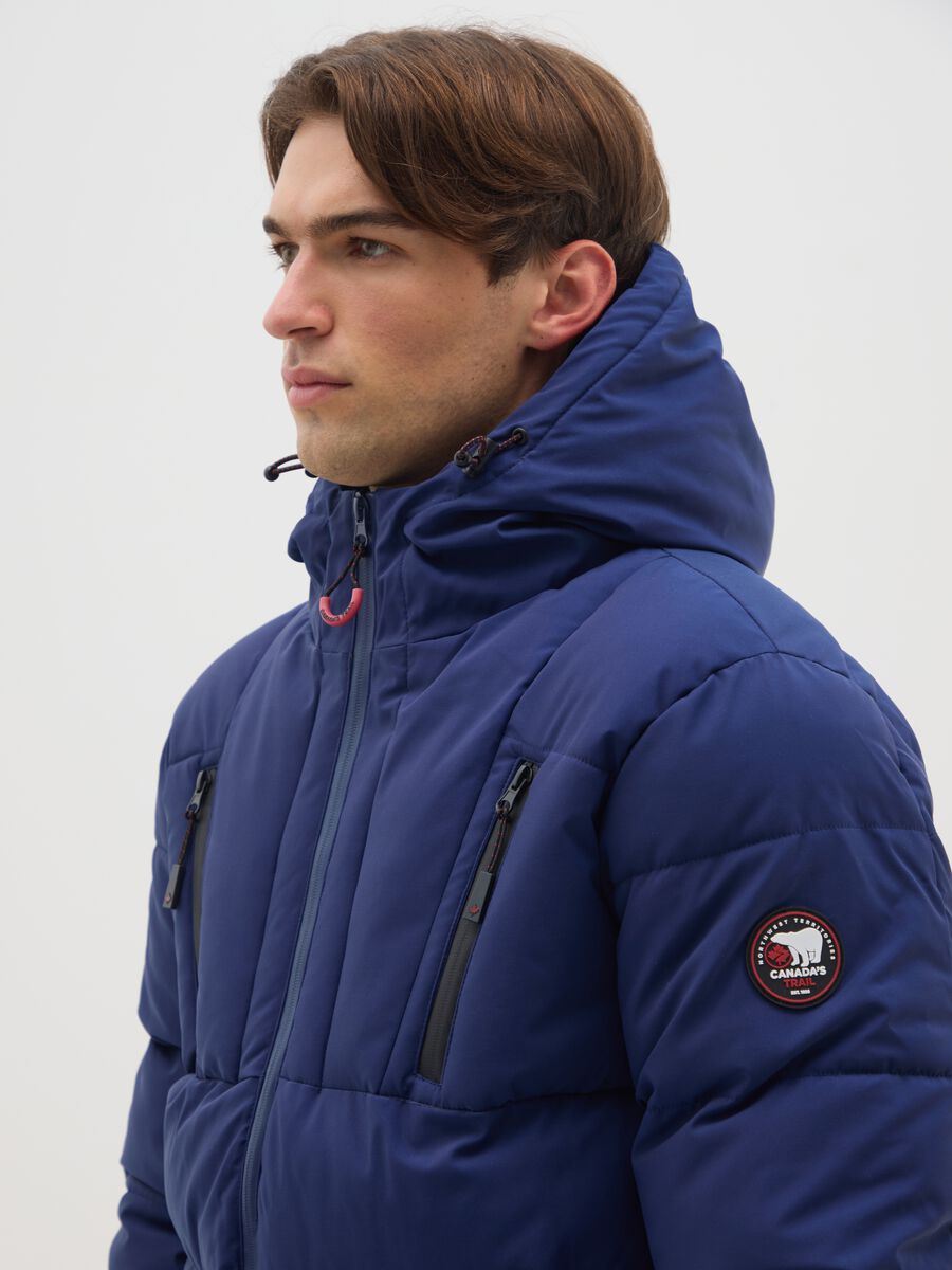 Blue padded jacket with hood and zip_3
