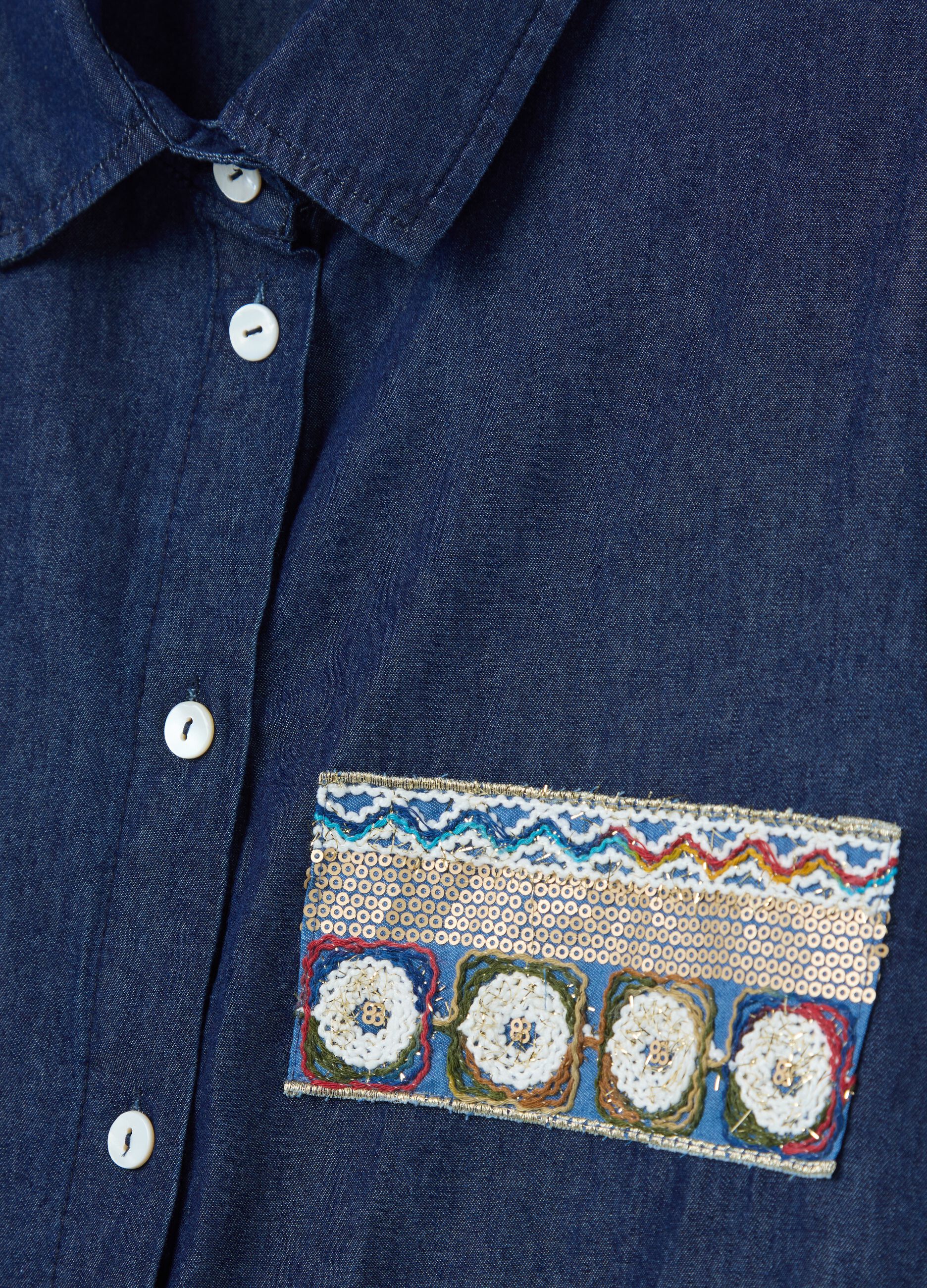 Denim shirt with sequinned patch