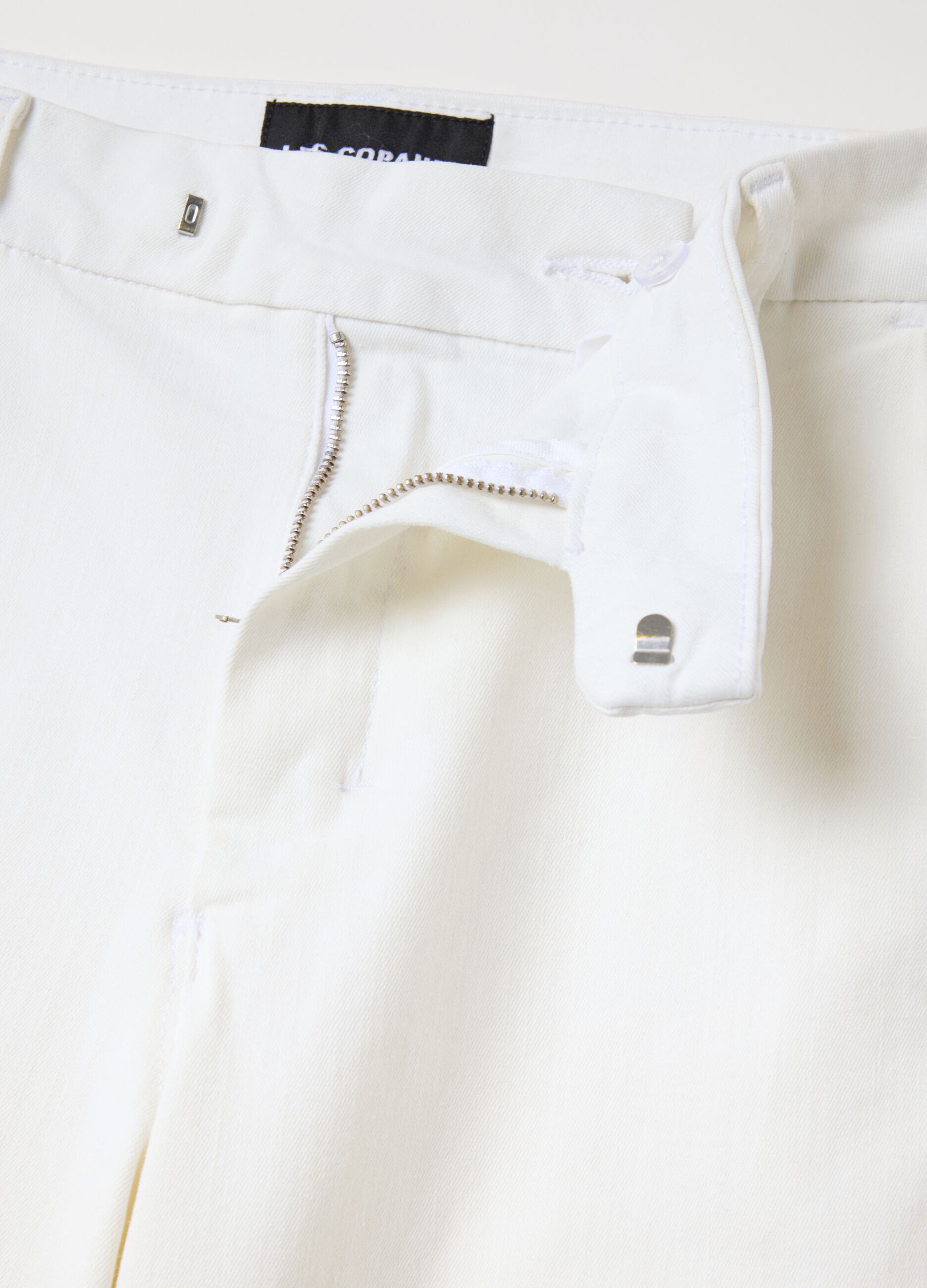 White bootcut jeans with pockets