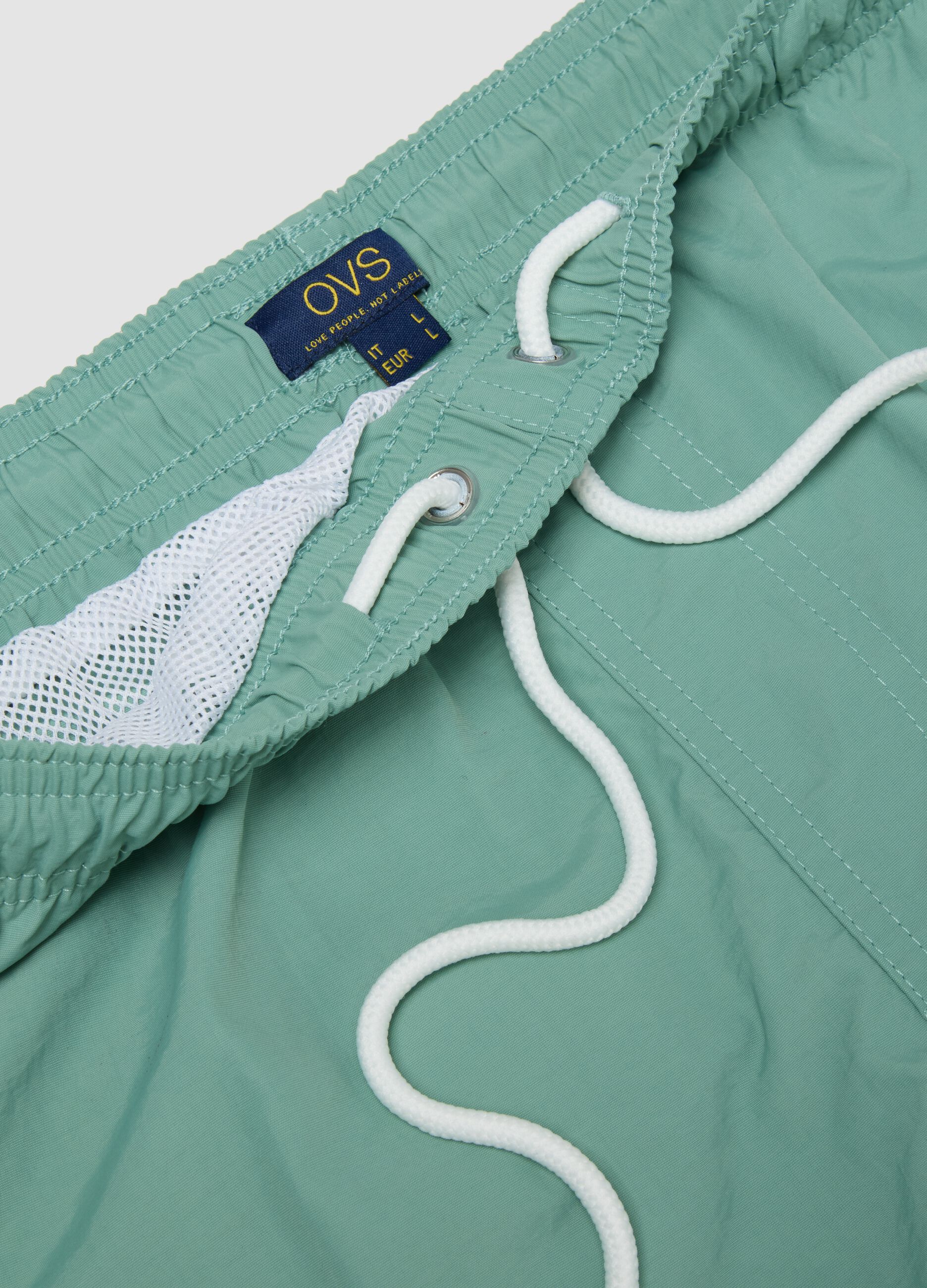 Green swim shorts with elasticated waistband