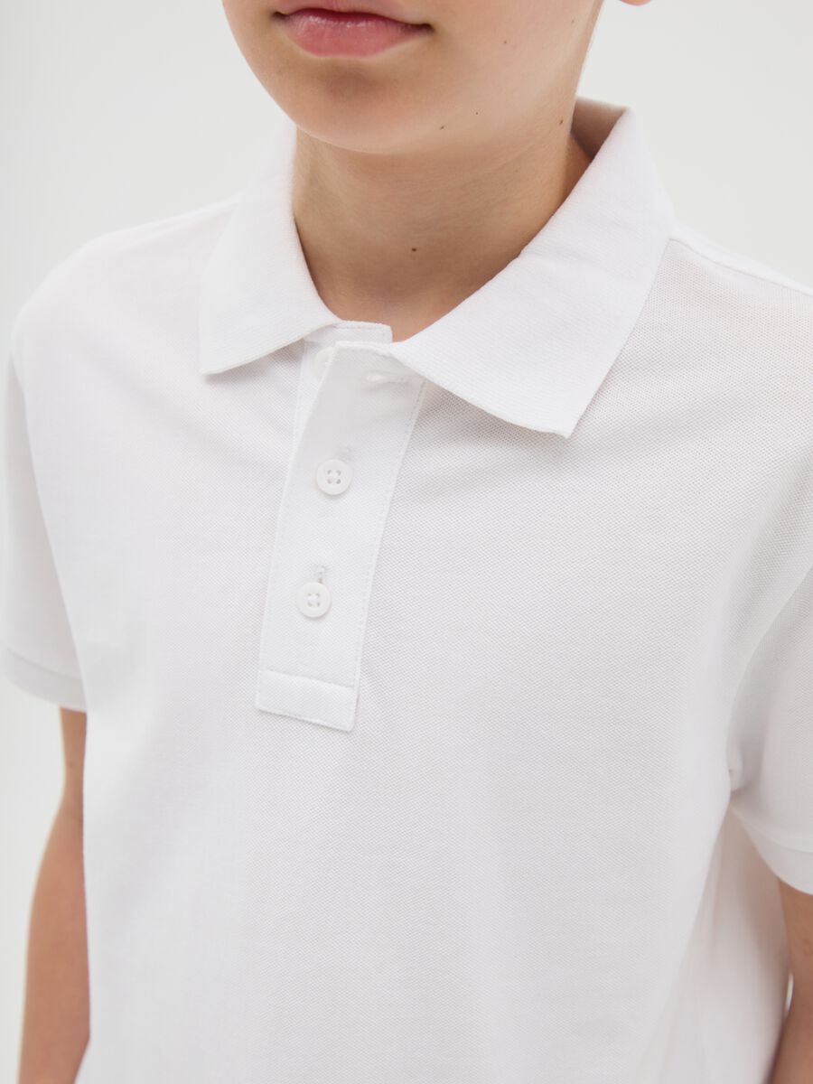 Polo da ragazzo in puro cotone bianca regular fit_1