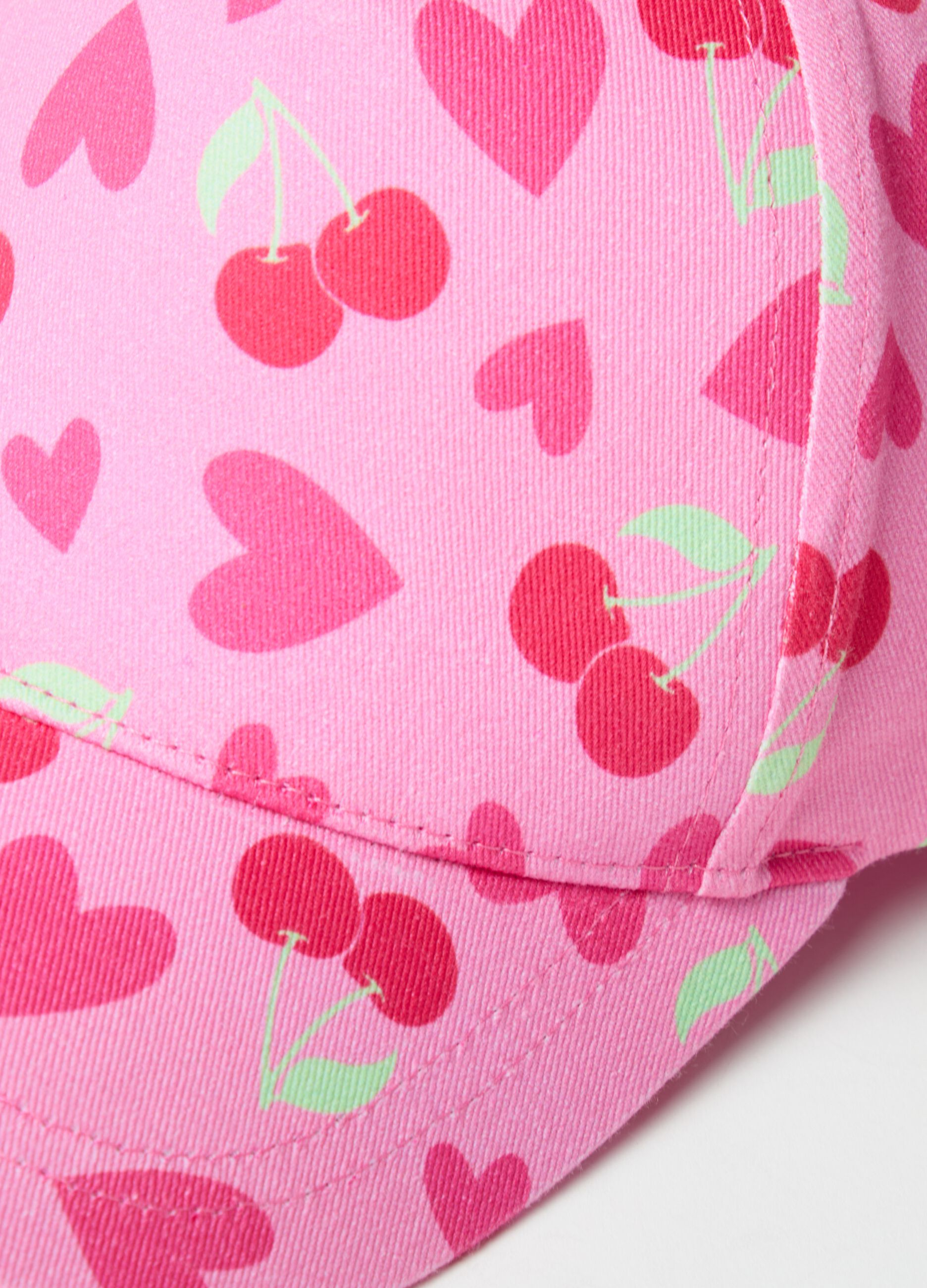 Baseball cap with cherries and hearts print