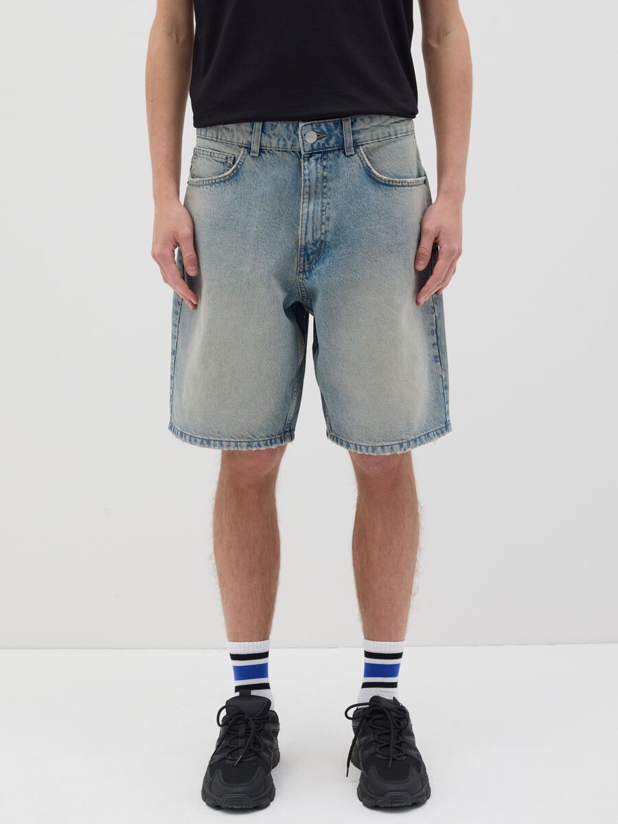 Light blue denim shorts with ripped details_1