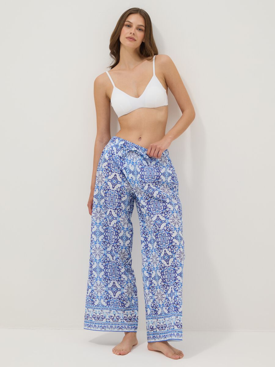 Blue pure cotton trousers with all-over print_0