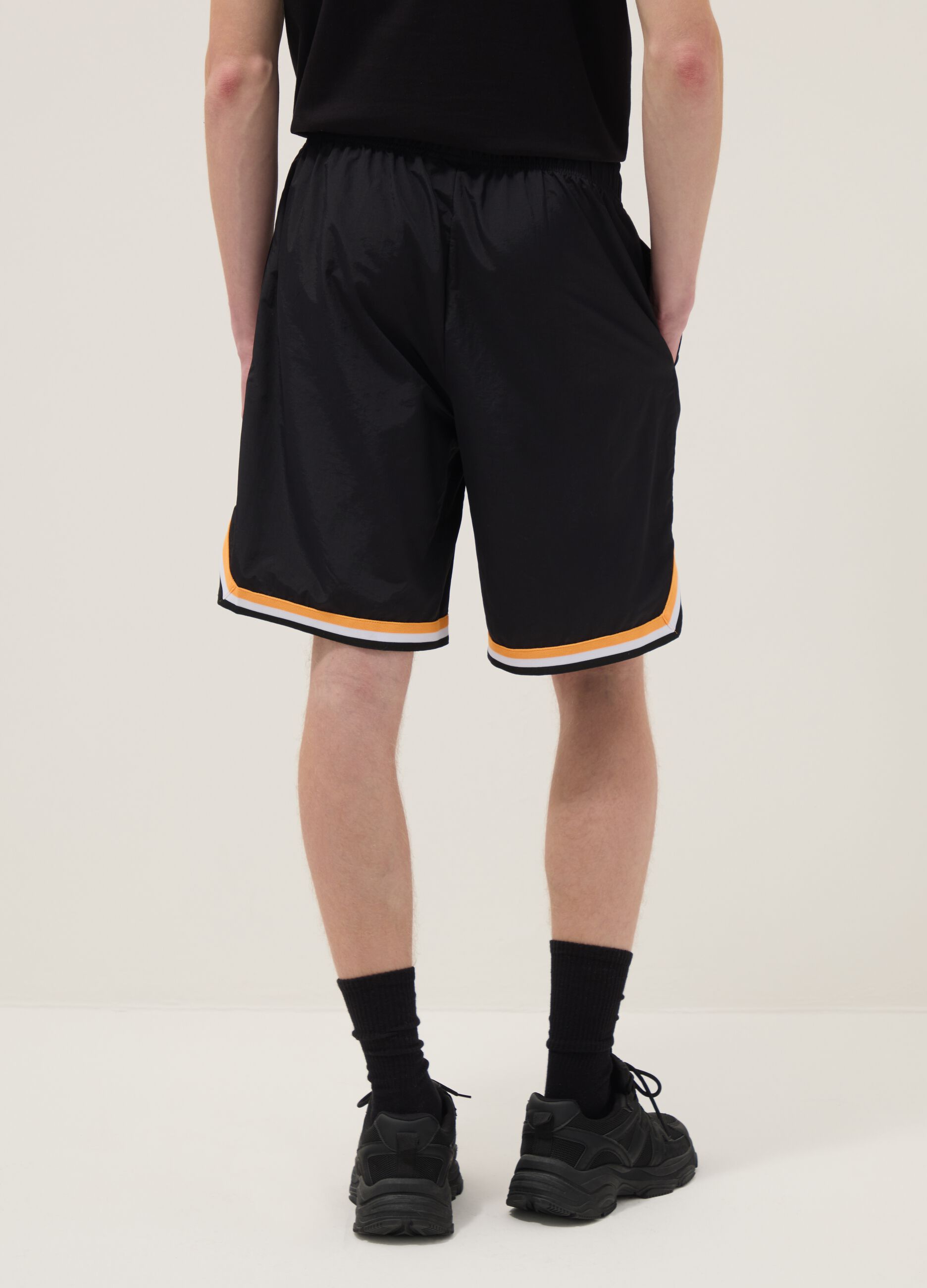 Regular fit black sports shorts with white and orange details