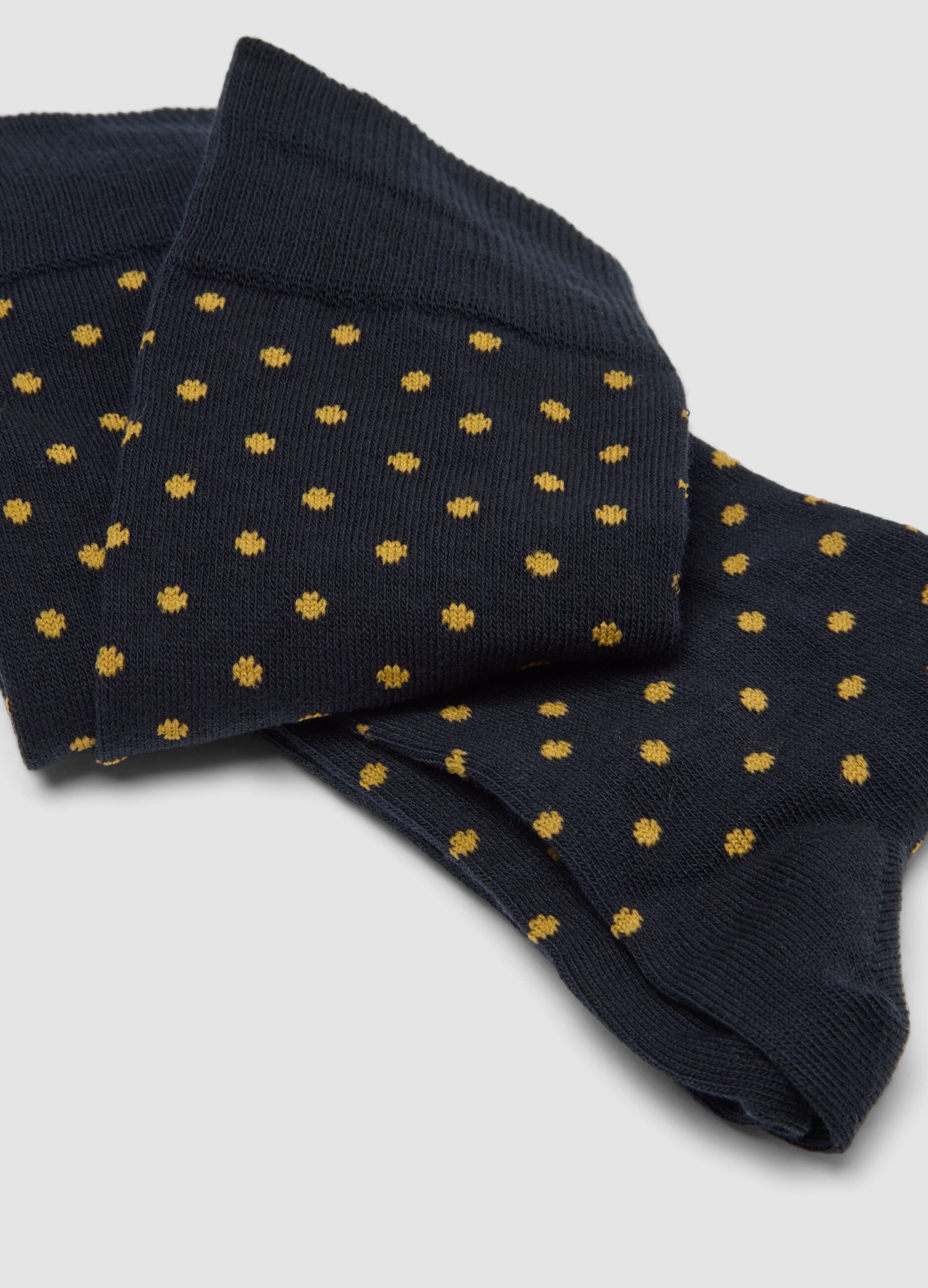 Two-pack of navy blue and golden yellow long socks in stretch cotton