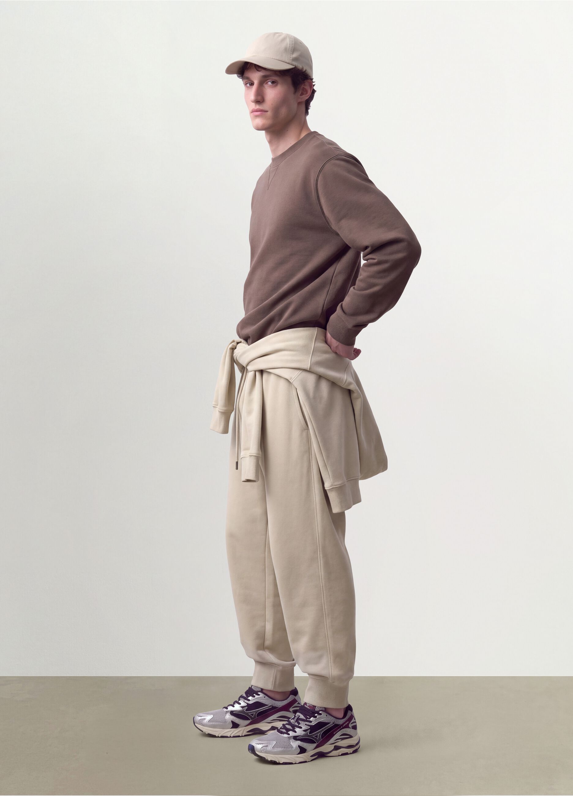 Beige cotton-blend joggers with cuffed hems and drawstring