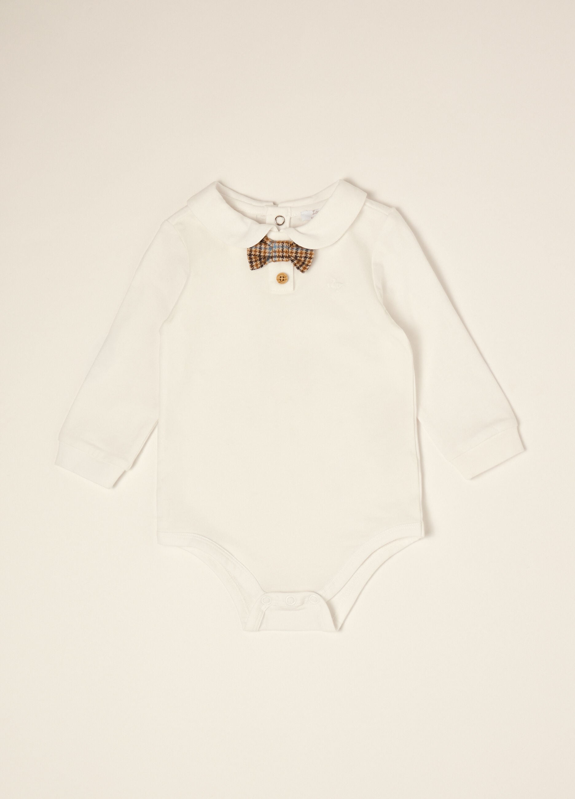 White organic stretch cotton baby bodysuit with bow