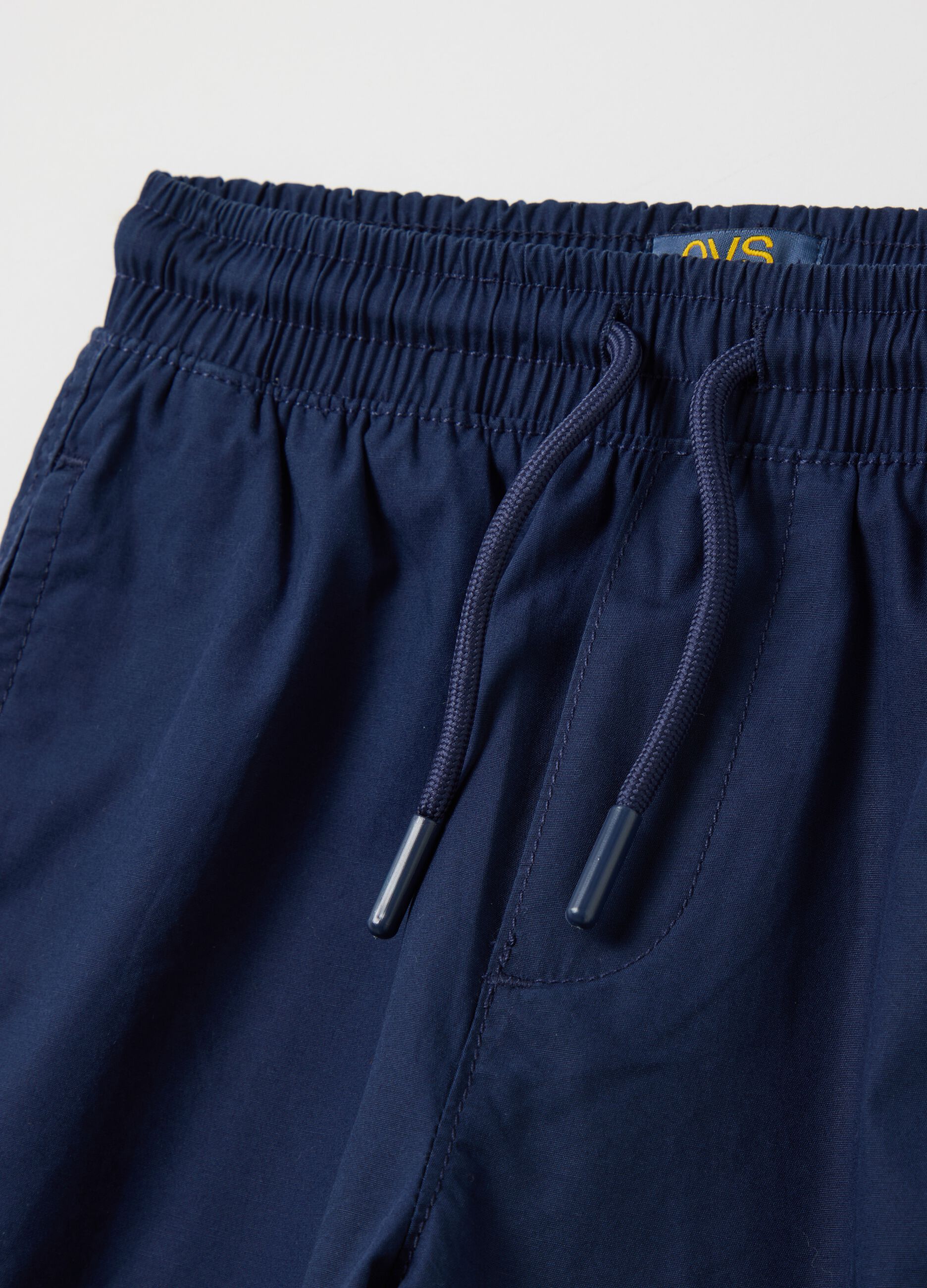 Blue boys’ shorts in 100% cotton with regular fit and  elasticated waist