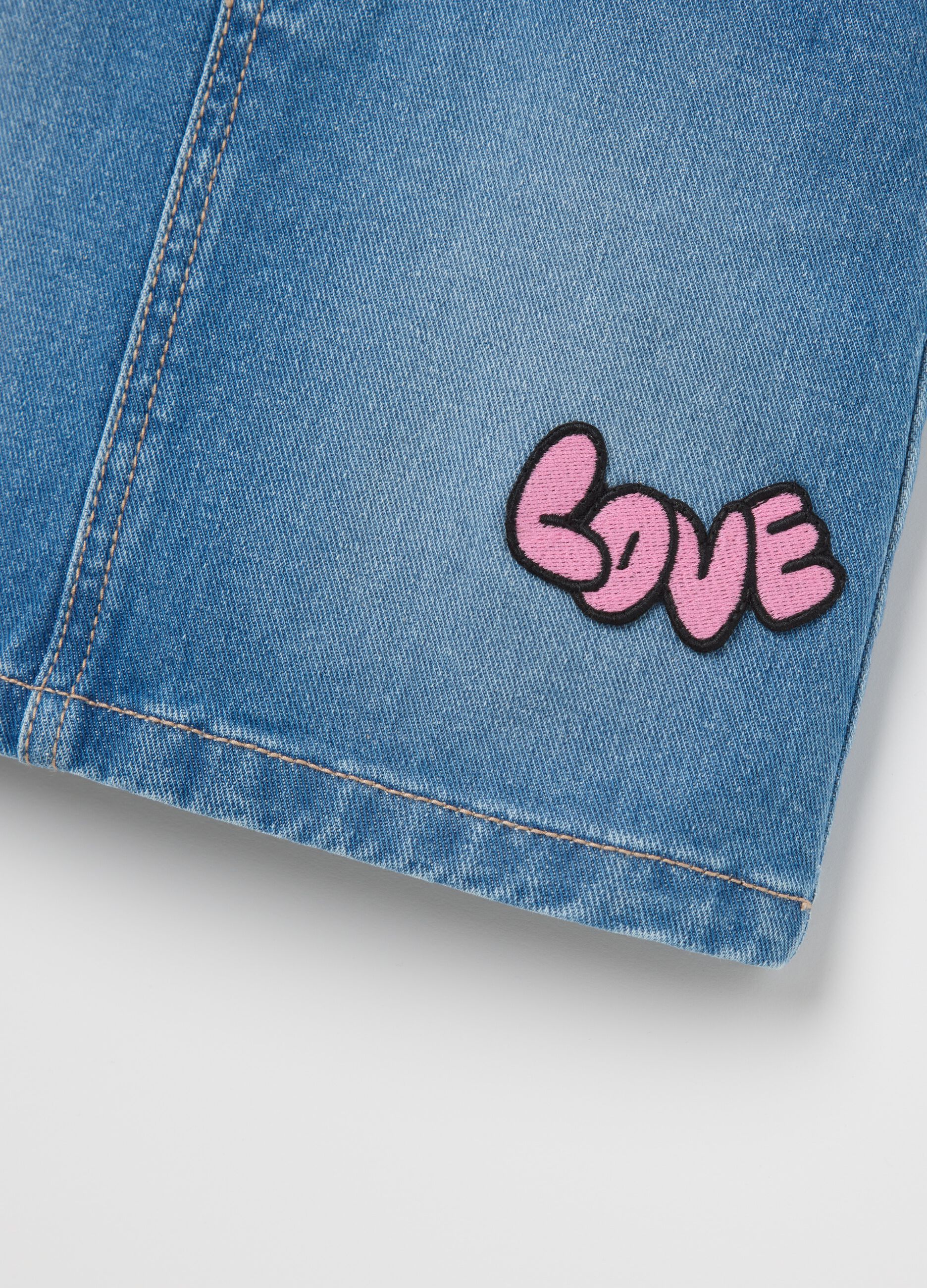 Denim pinafore with "Love" patch and diamantés