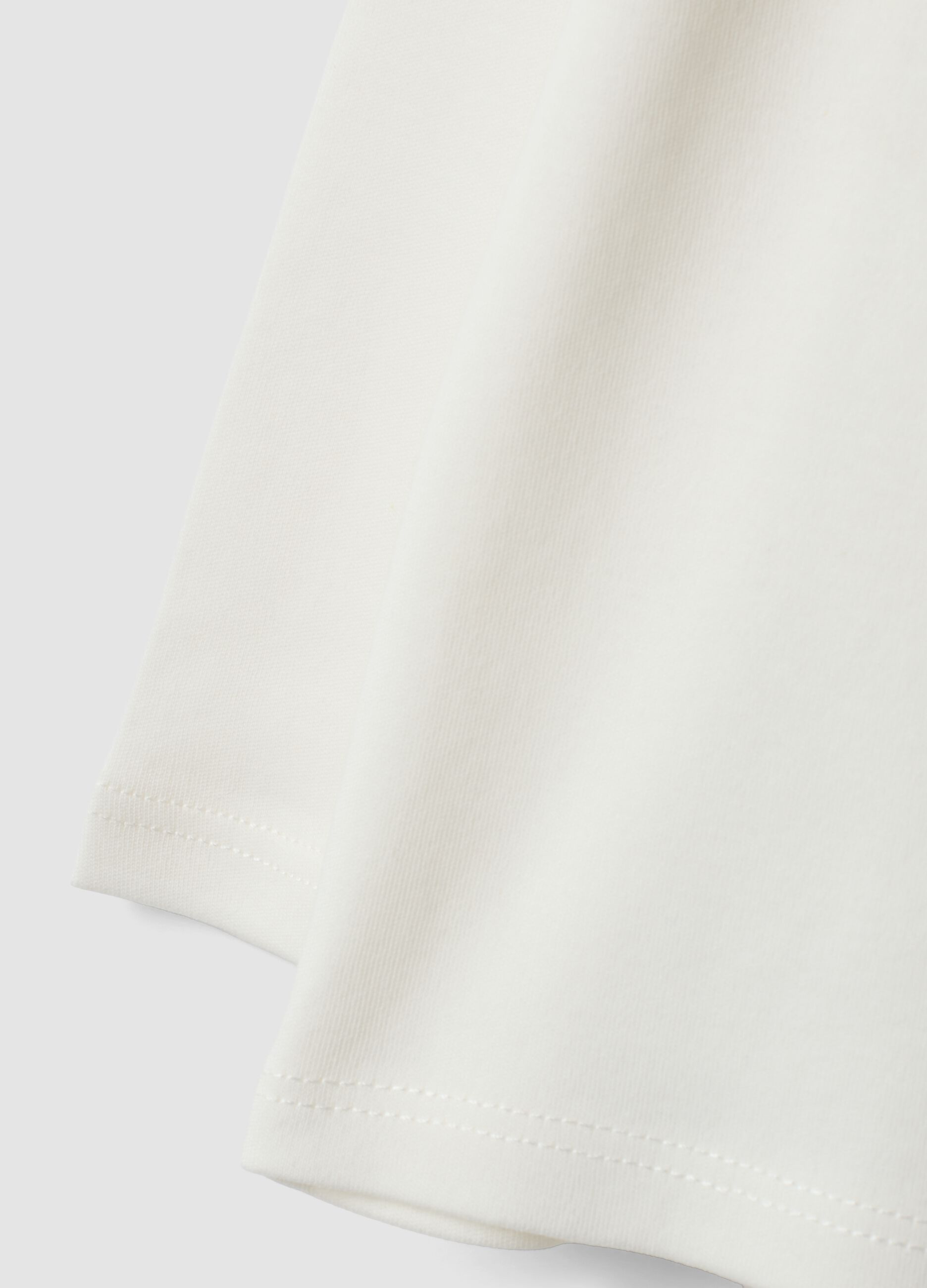 Polo bianca in puro cotone organico a maniche lunghe