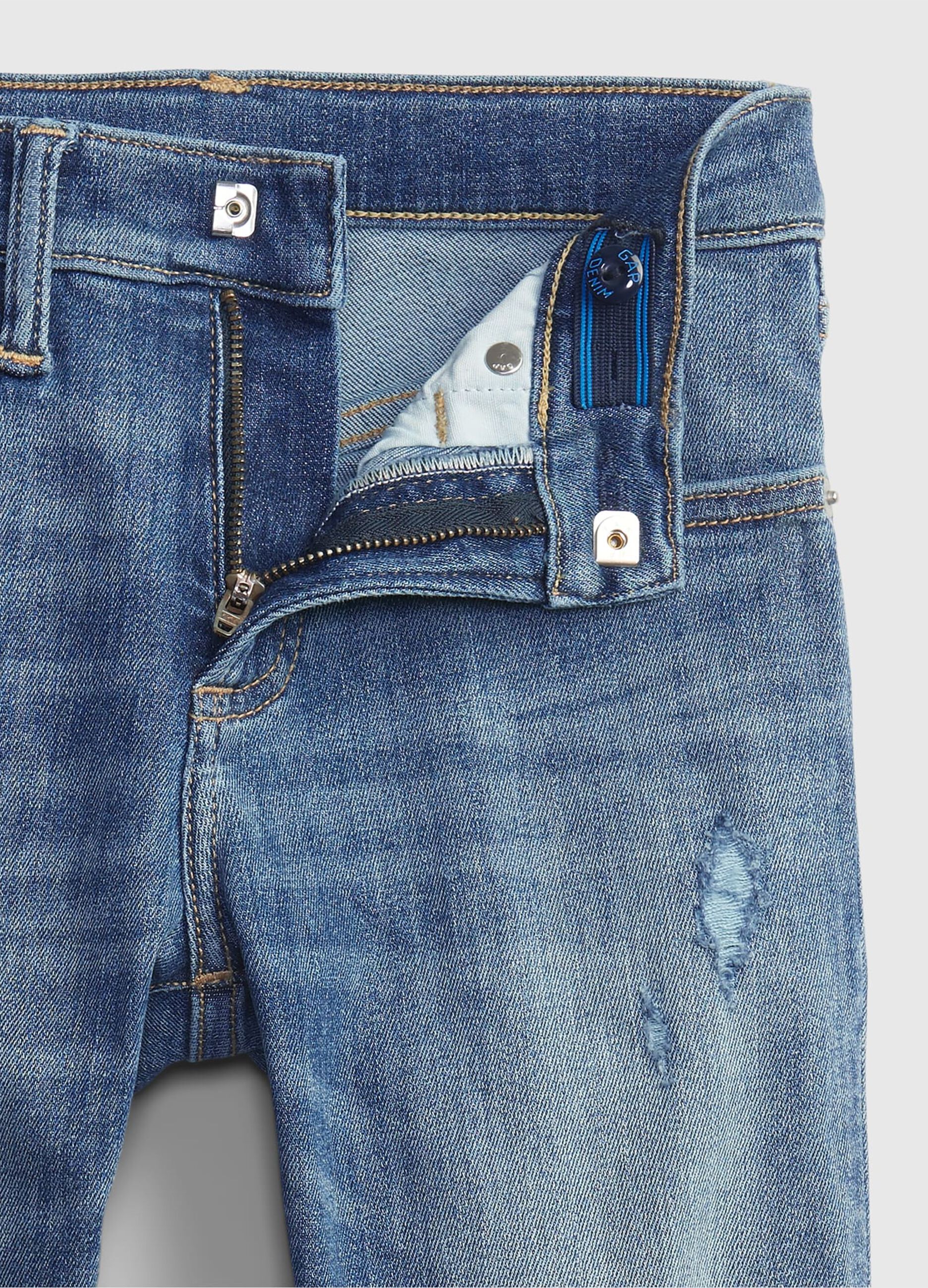 Jeans skinny fit con abrasioni