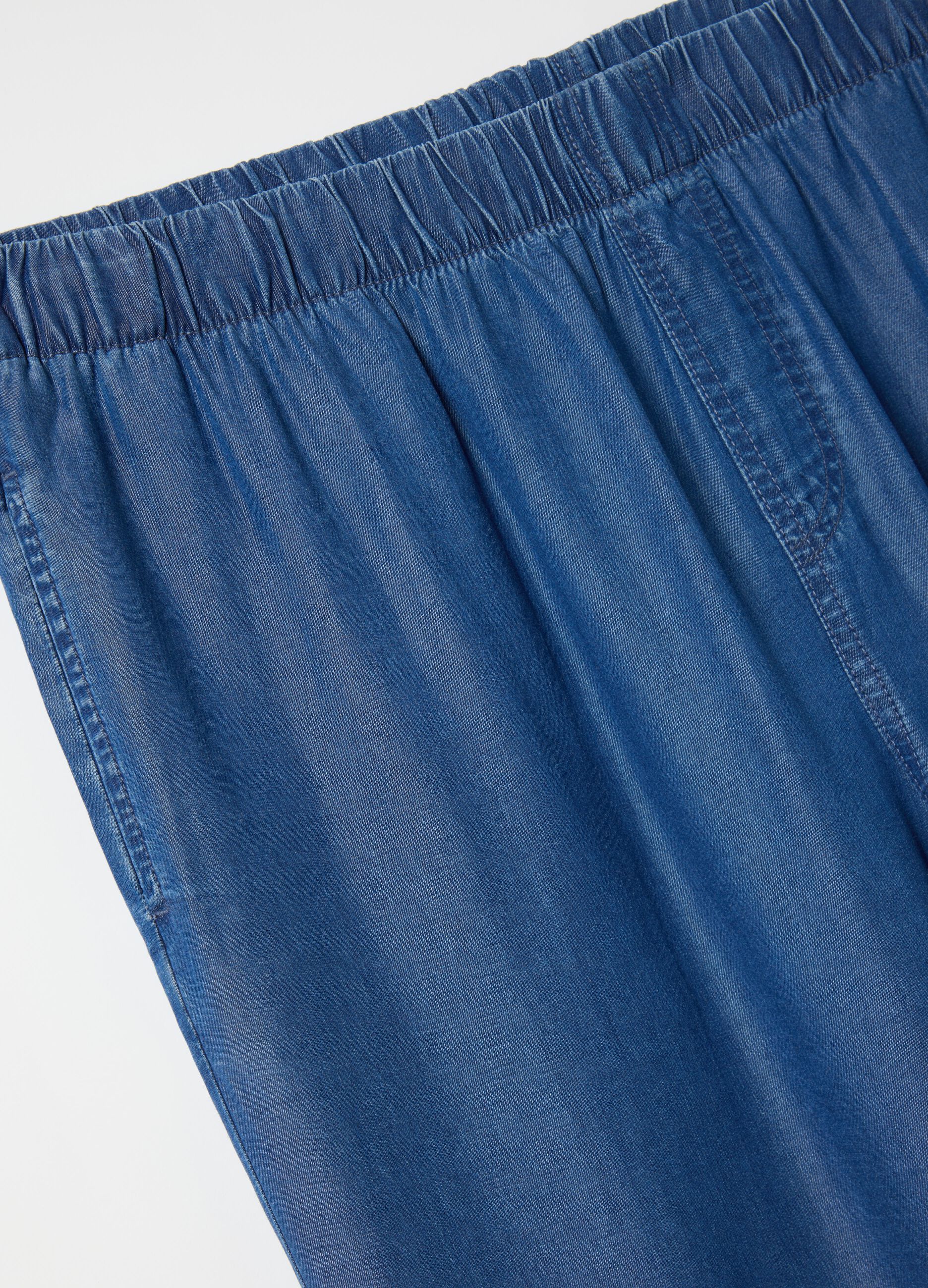 Curvy blue jogger trousers with denim effect