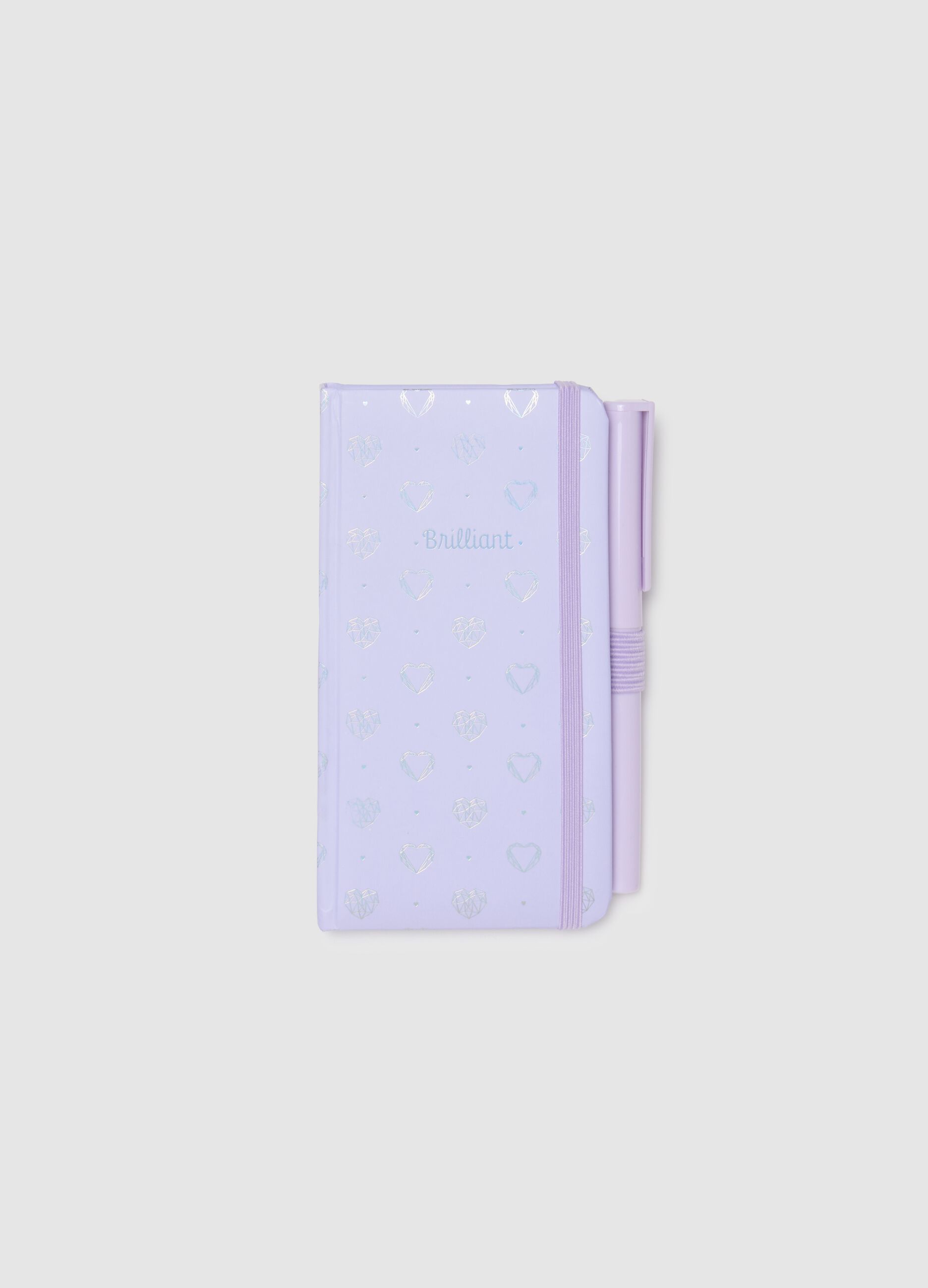 Purple paper notebook with elastic closure and pen