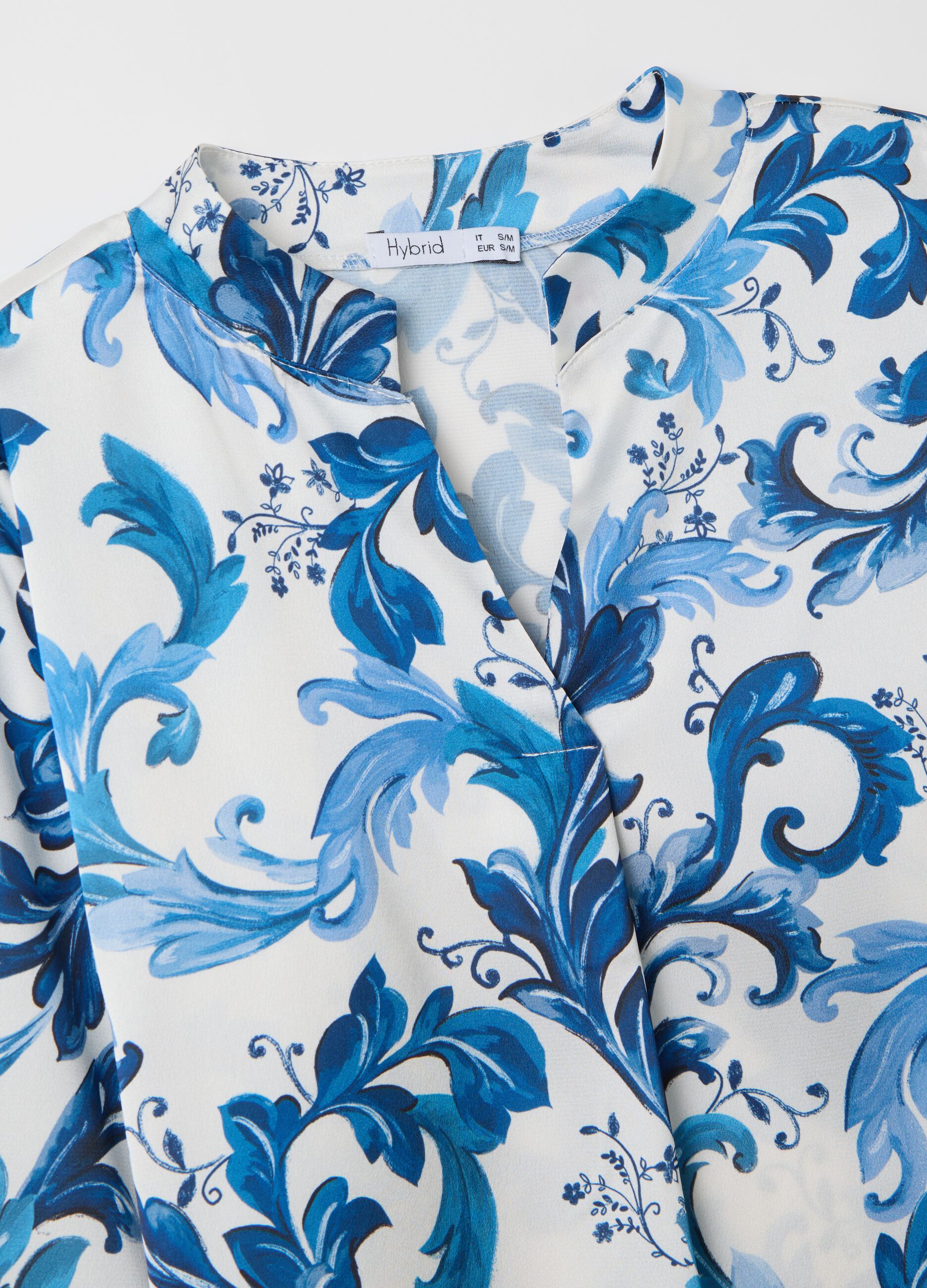 White and blue blouse with print
