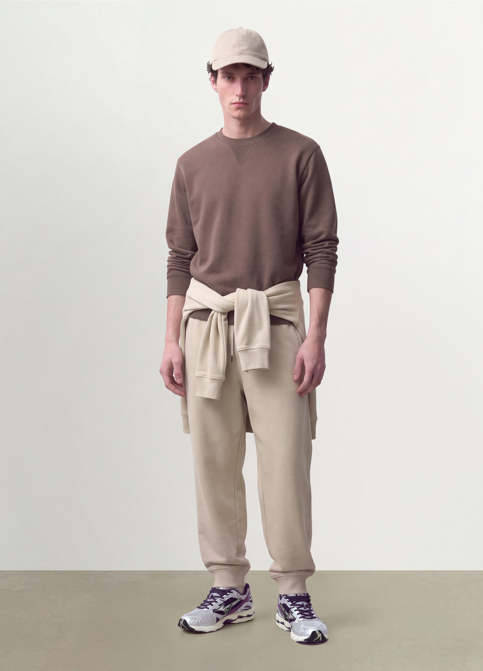 Beige cotton-blend joggers with cuffed hems and drawstring