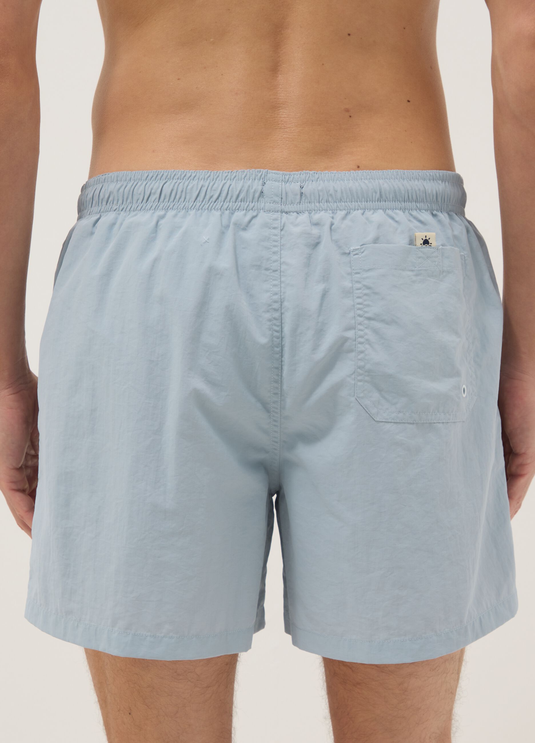 Blue swim shorts with elasticated waistband