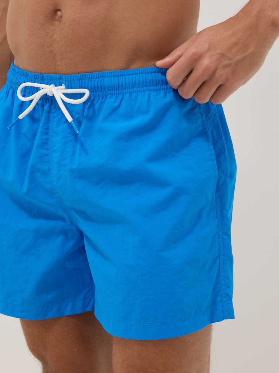 Blue swim shorts with elasticated waistband_3