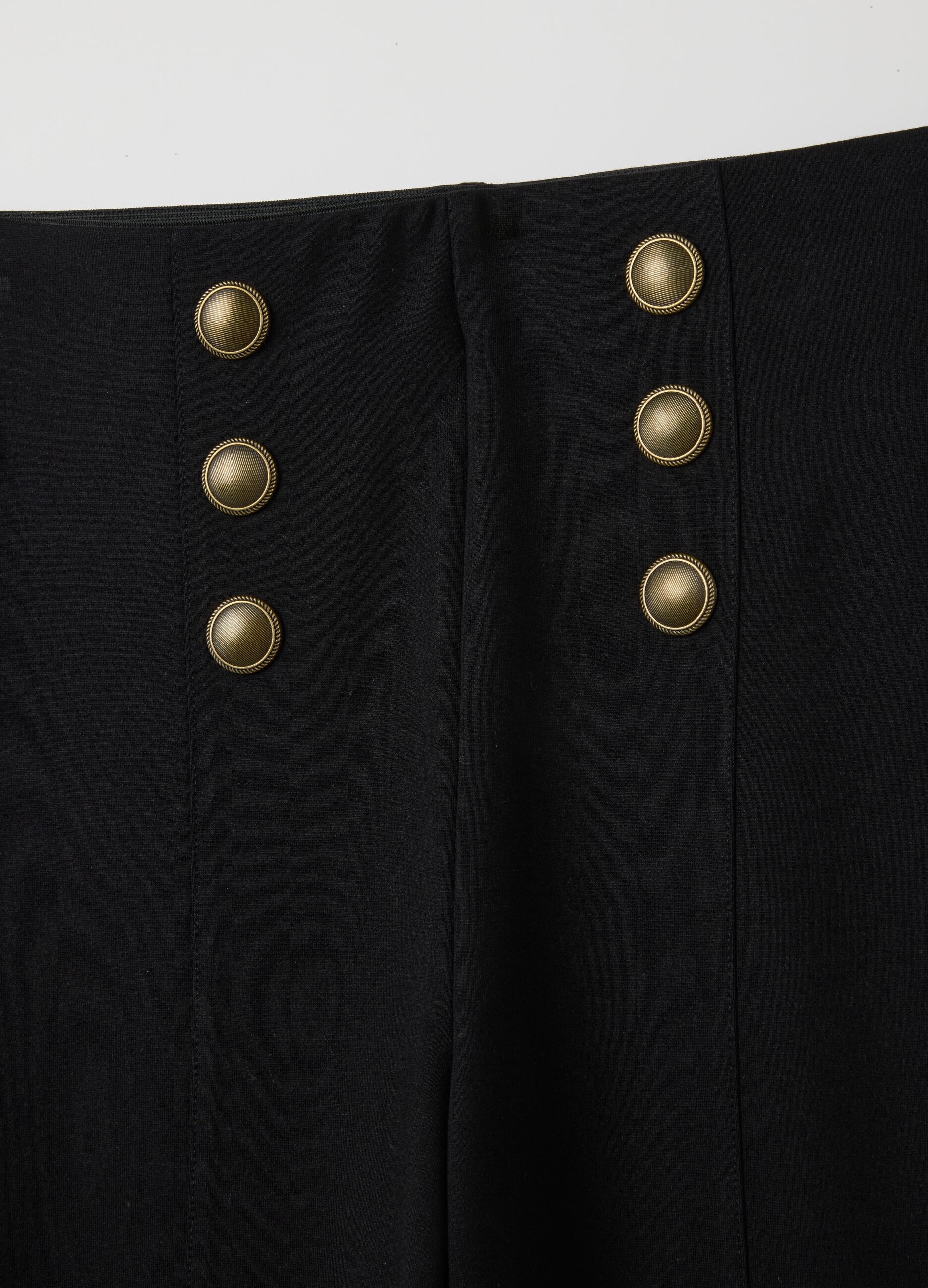 Black stretch leggings with decorative buttons