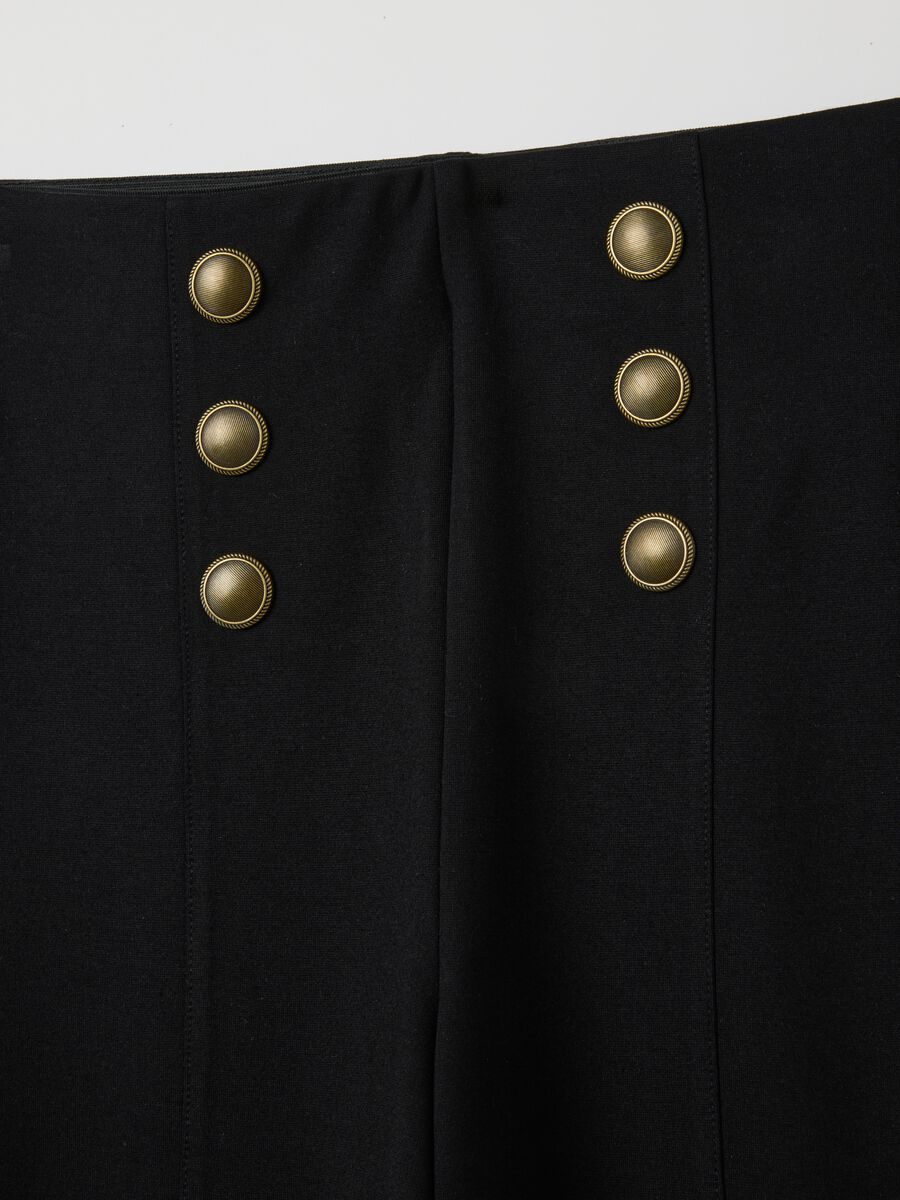 Black stretch leggings with decorative buttons_1