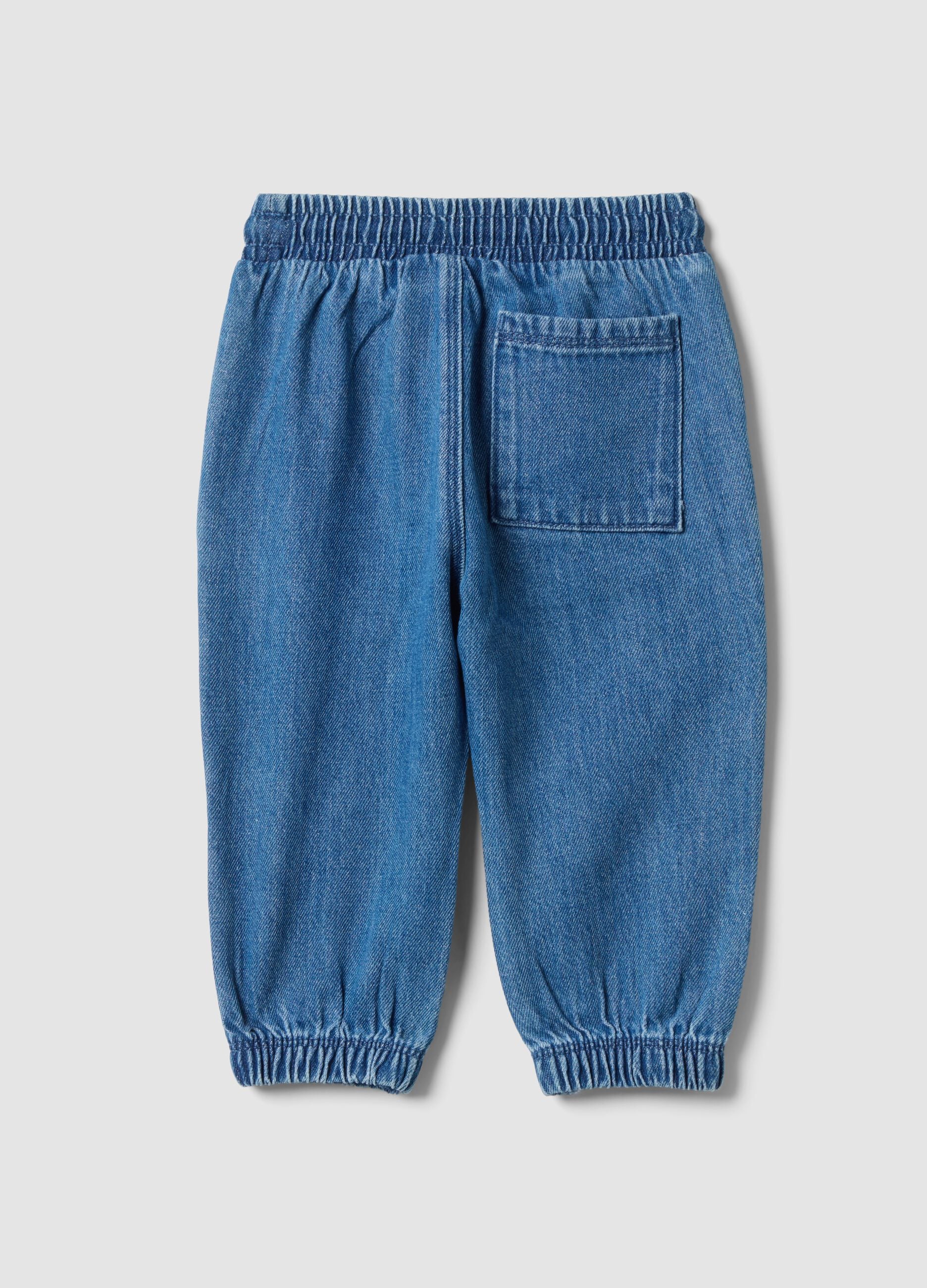 Blue denim trousers in a cotton and viscose blend with an elasticated waistband